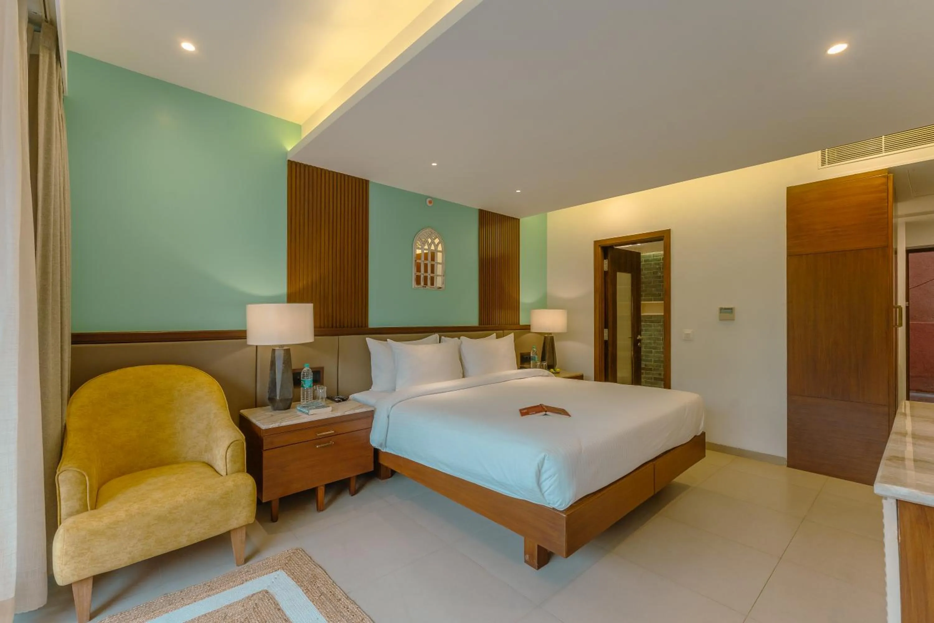 Bed in Mandrem Beach Resort, a member of Radisson Individuals Retreat