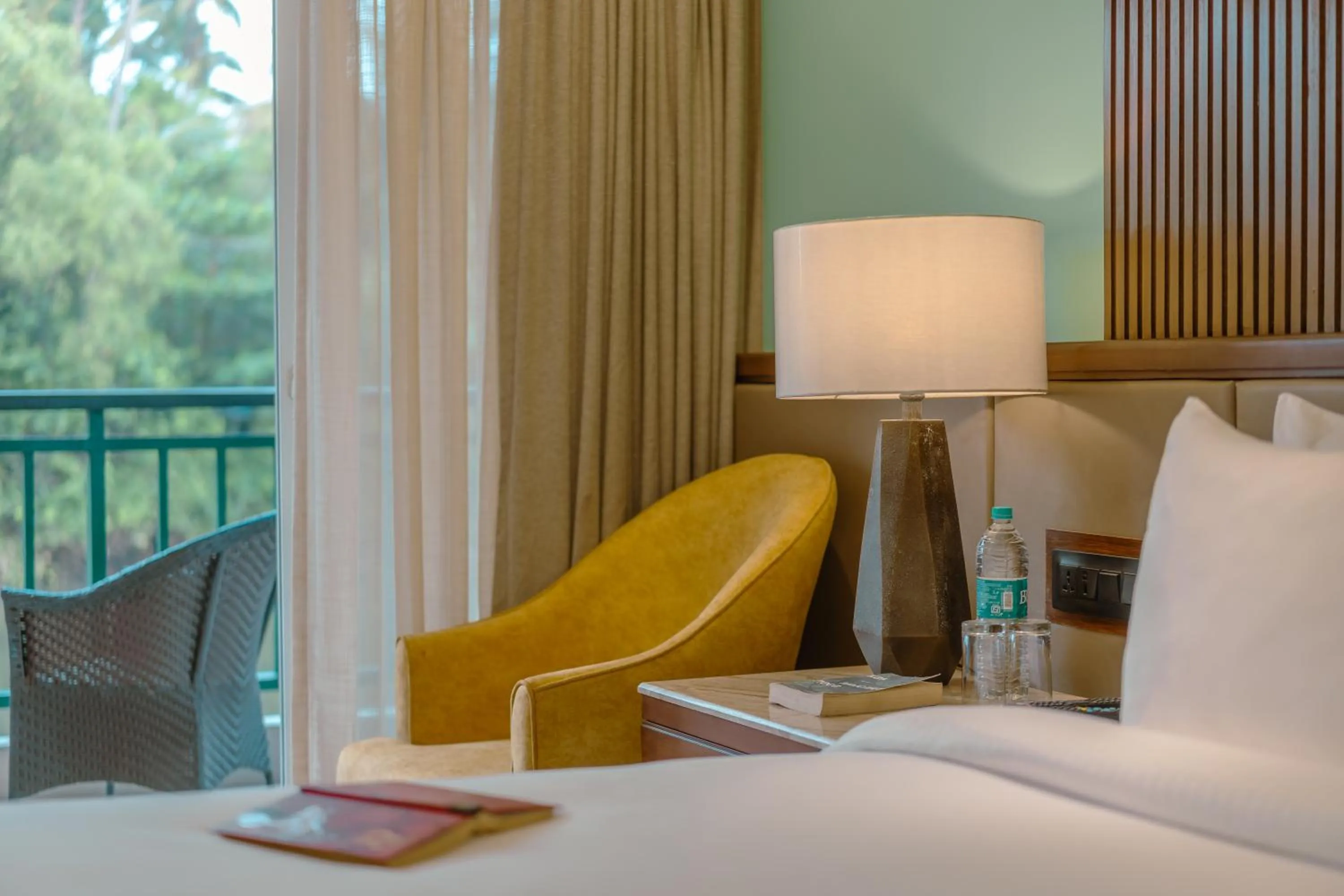 Seating area, Bed in Mandrem Beach Resort, a member of Radisson Individuals Retreat
