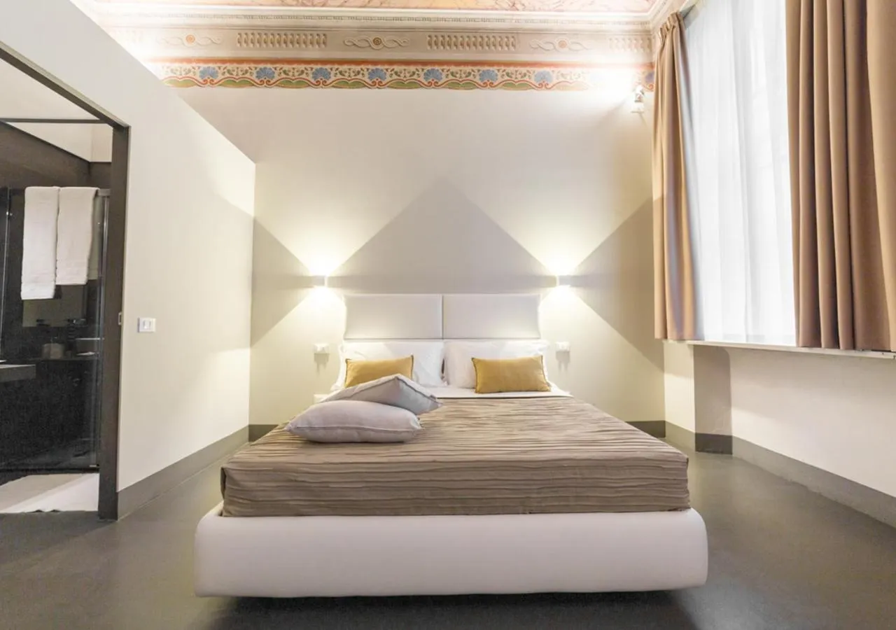 Bed in LUCUS Exclusive Bed and Breakfast