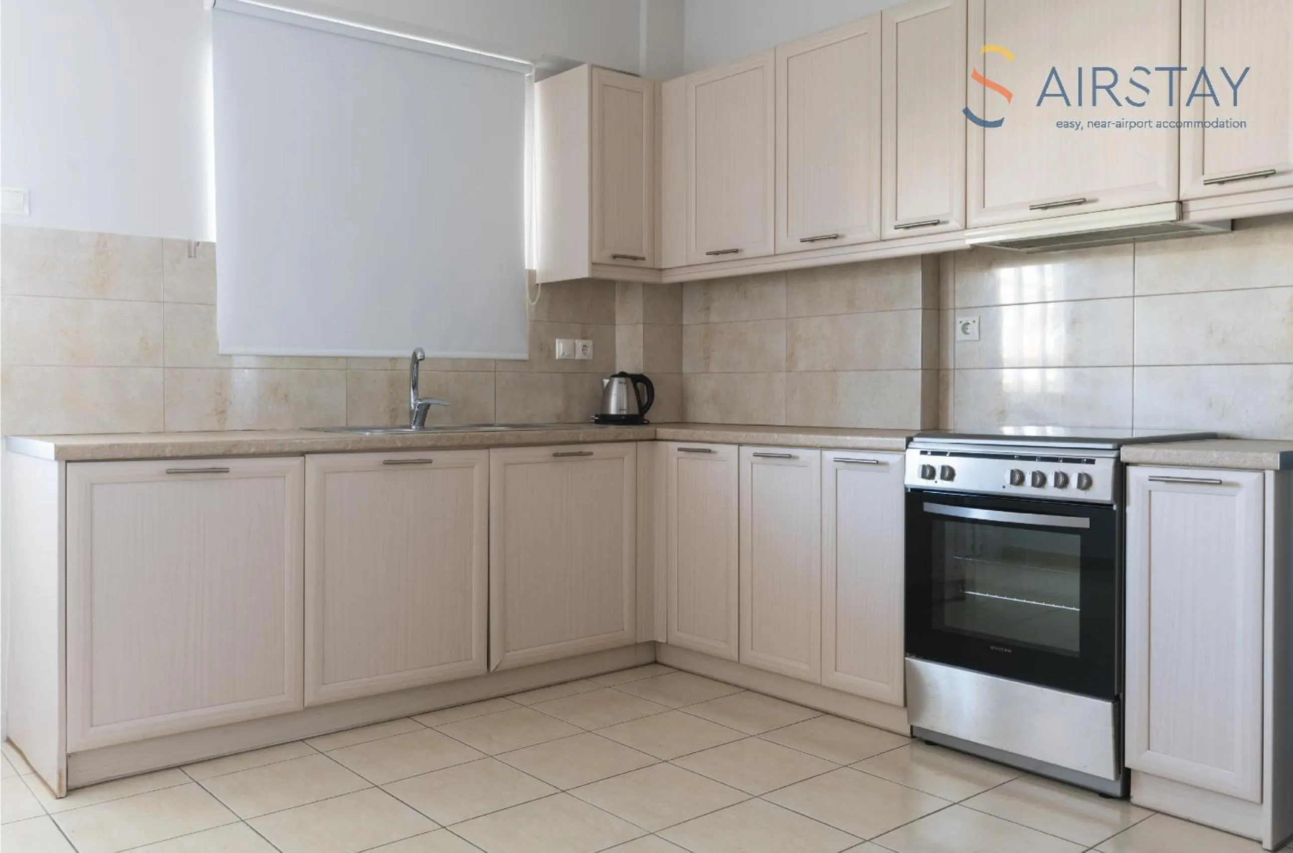 kitchen in Elise Apartment Airport by Airstay