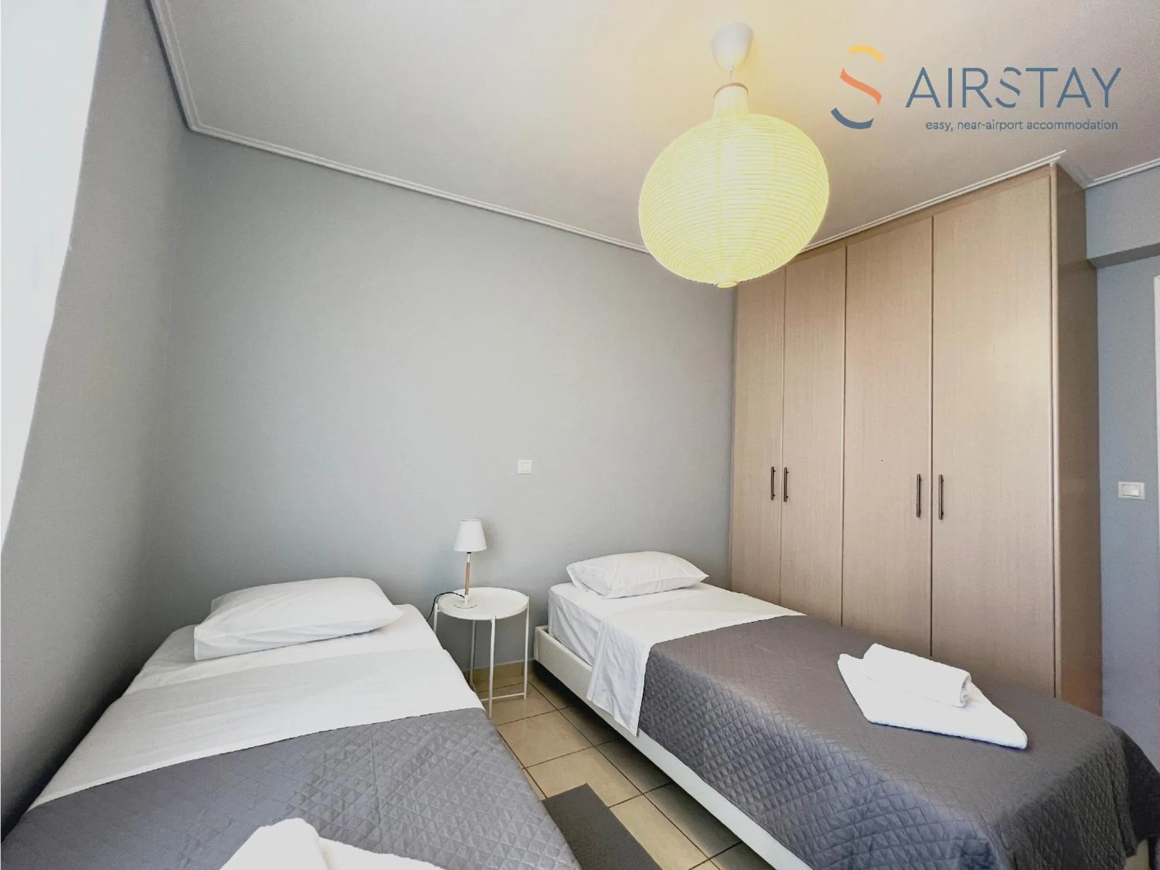 Bed in Elise Apartment Airport by Airstay