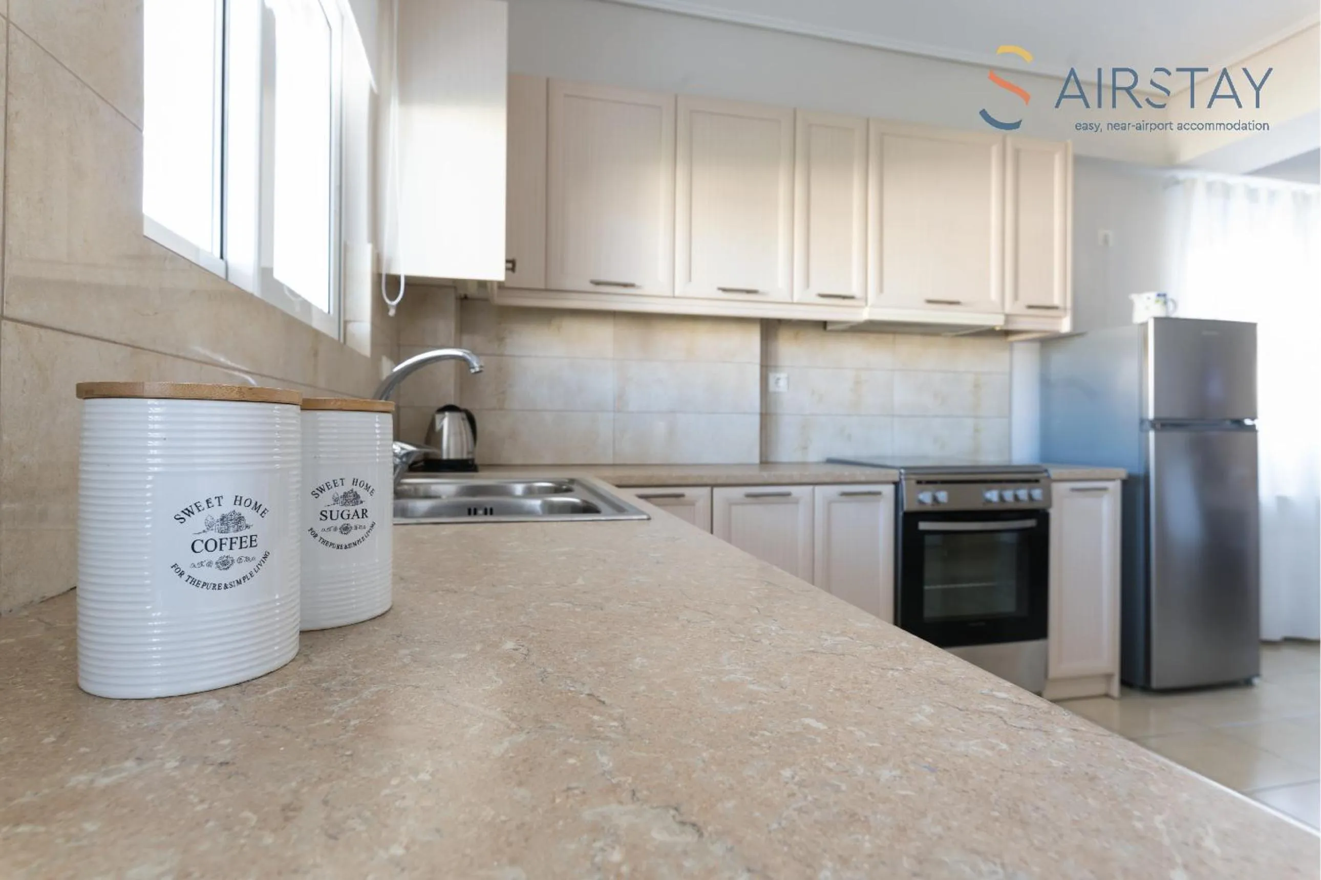 kitchen in Elise Apartment Airport by Airstay