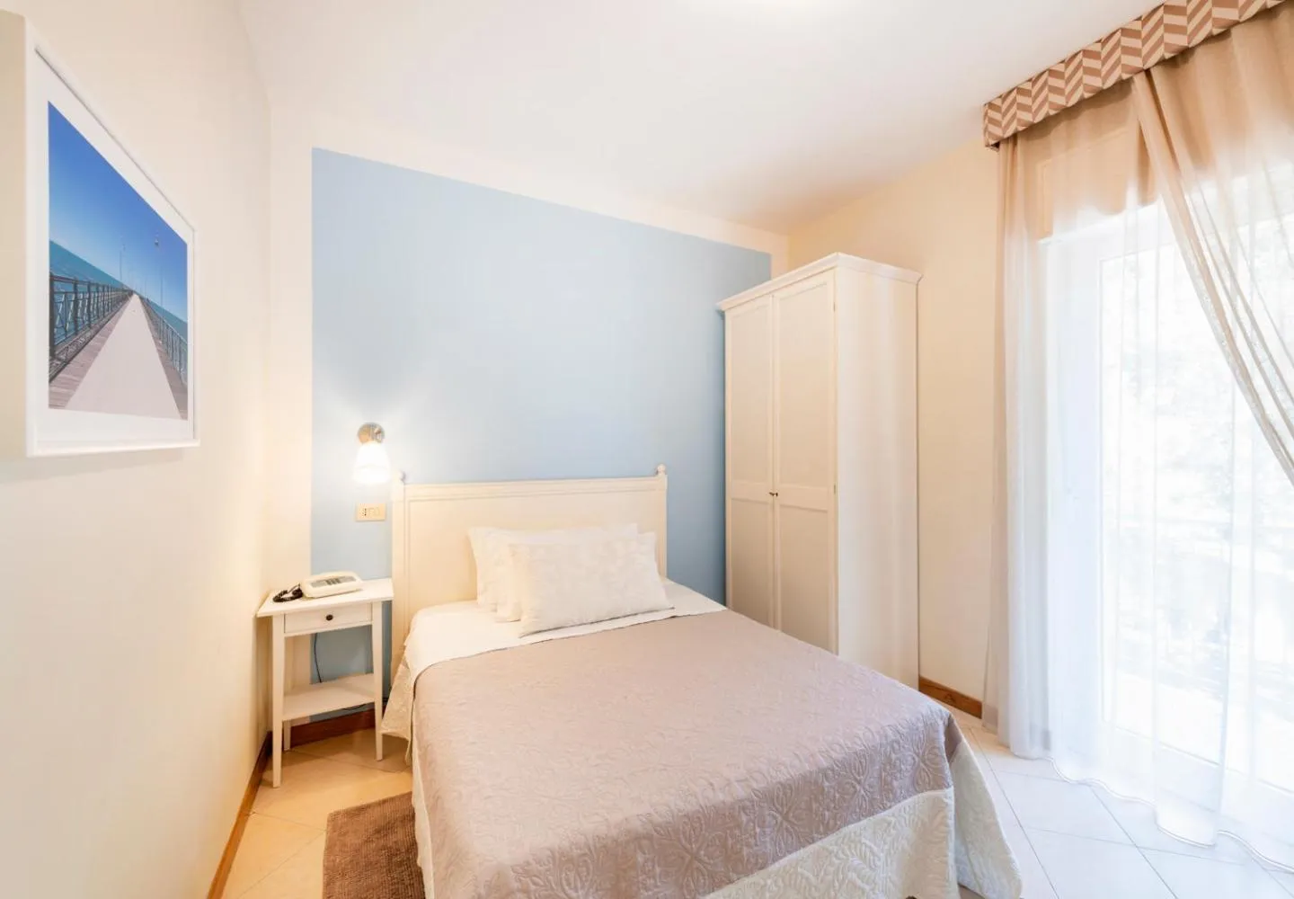 Bed in Hotel Andreaneri