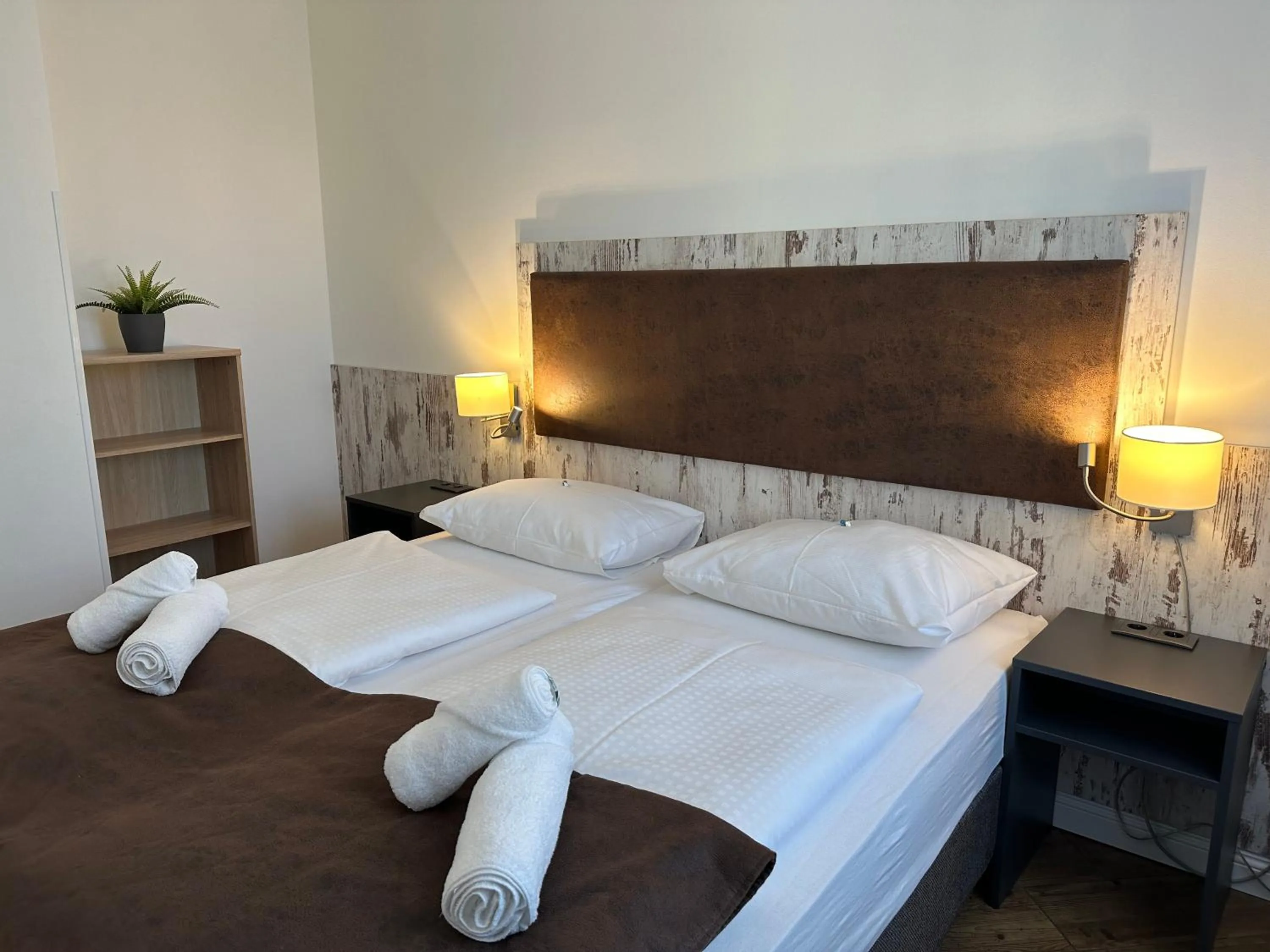 Bed in Versava Apartments