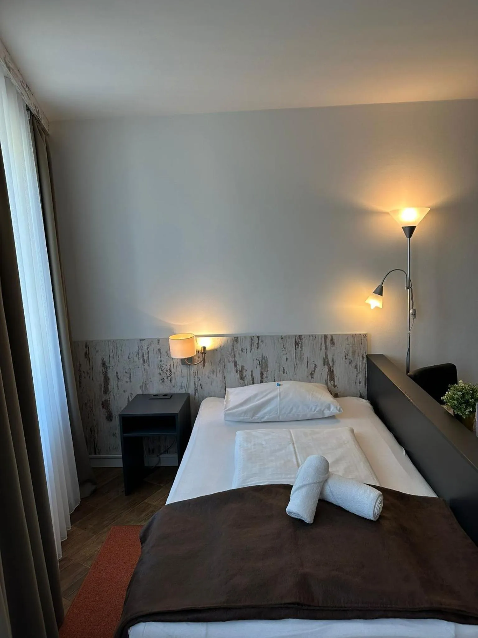 Bed in Versava Apartments