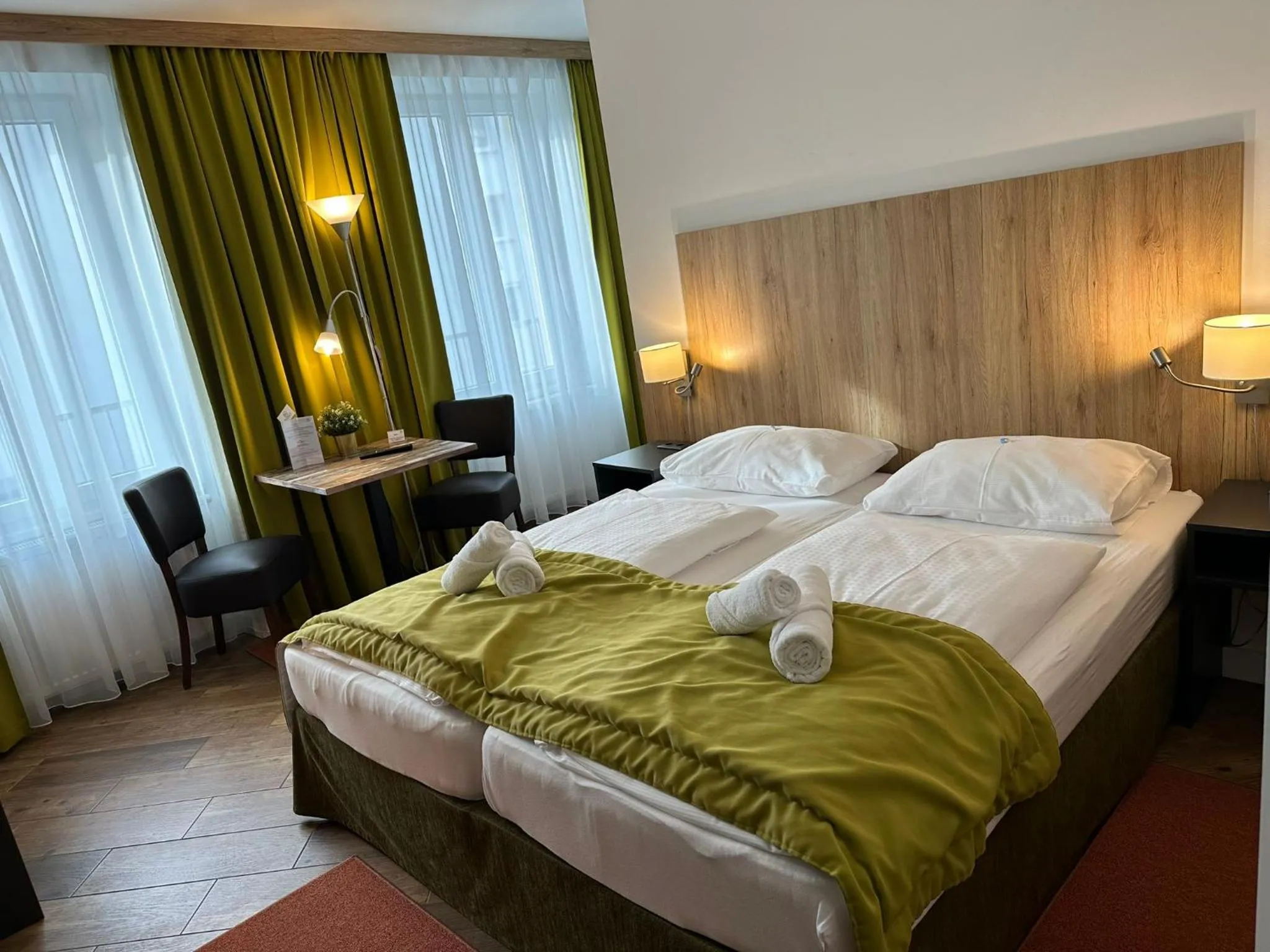 Bed in Versava Apartments