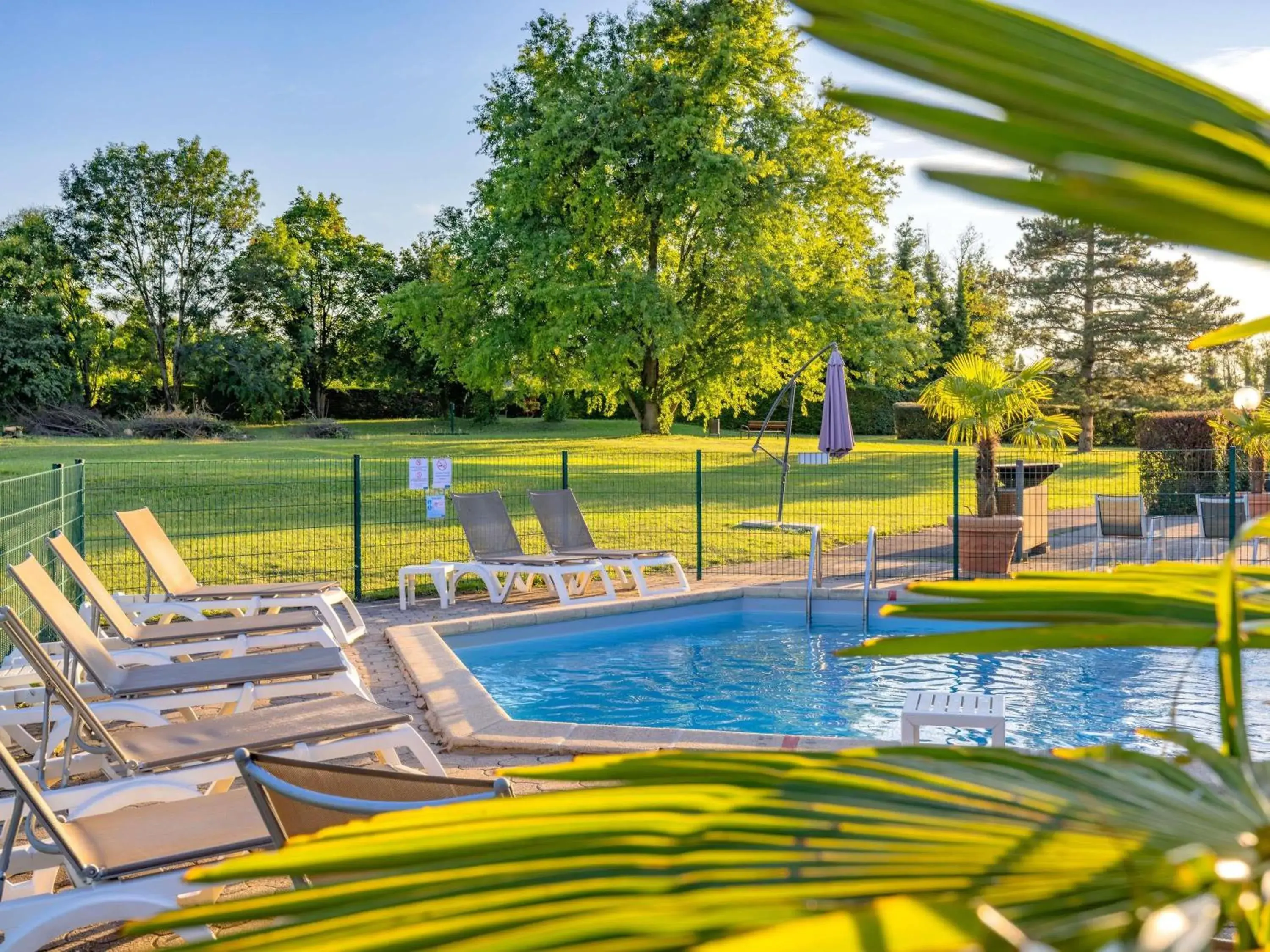 Pool view in Mercure Lyon Est Villefontaine Pool view in Mercure Lyon Est Villefontaine