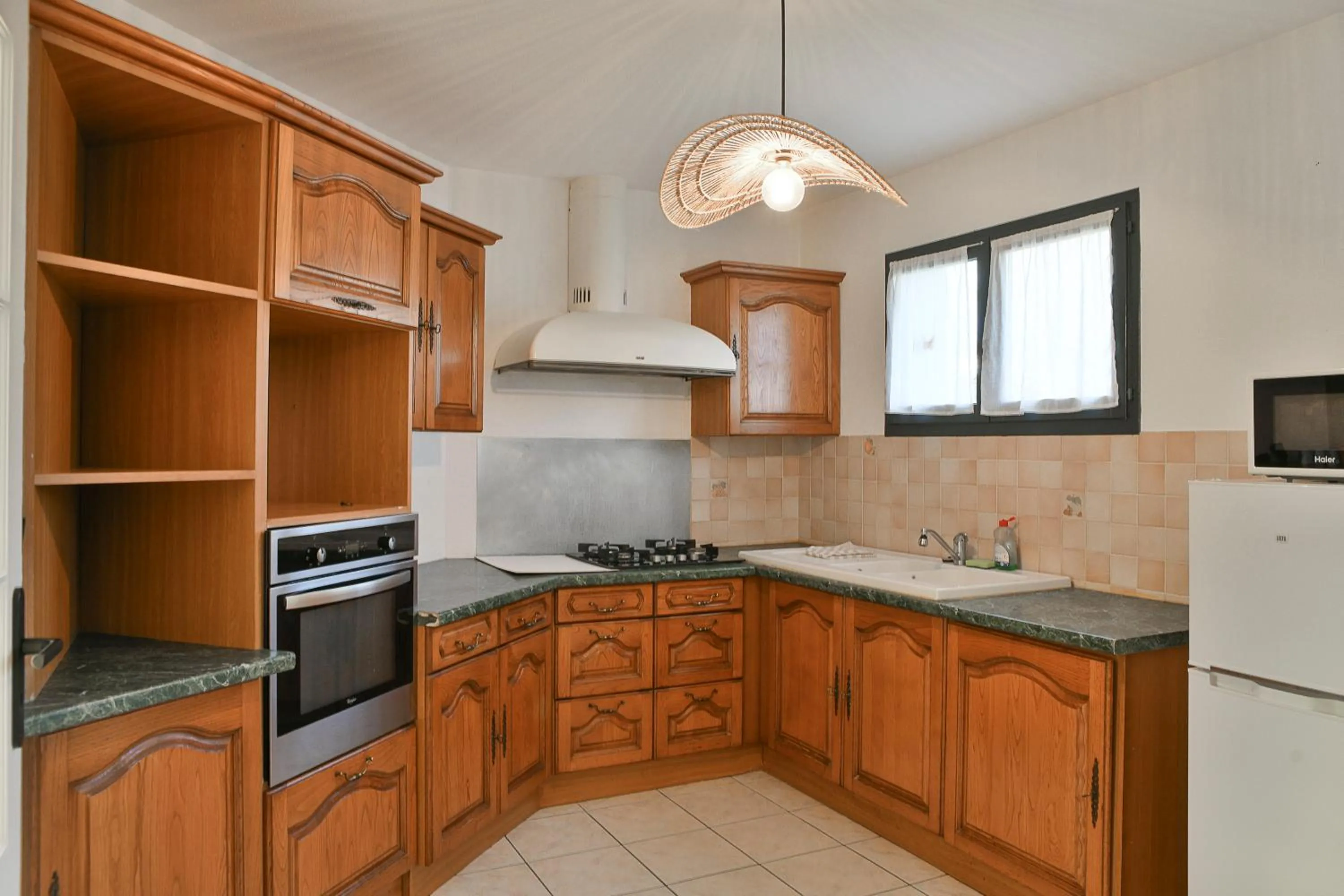 Kitchen or kitchenette in Les Villas du Domaine de Suzel
