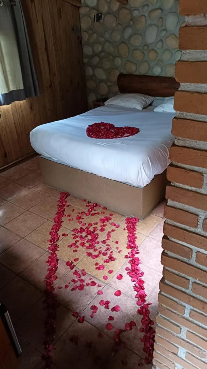 Bed in Cabañas El Estribo Hotel