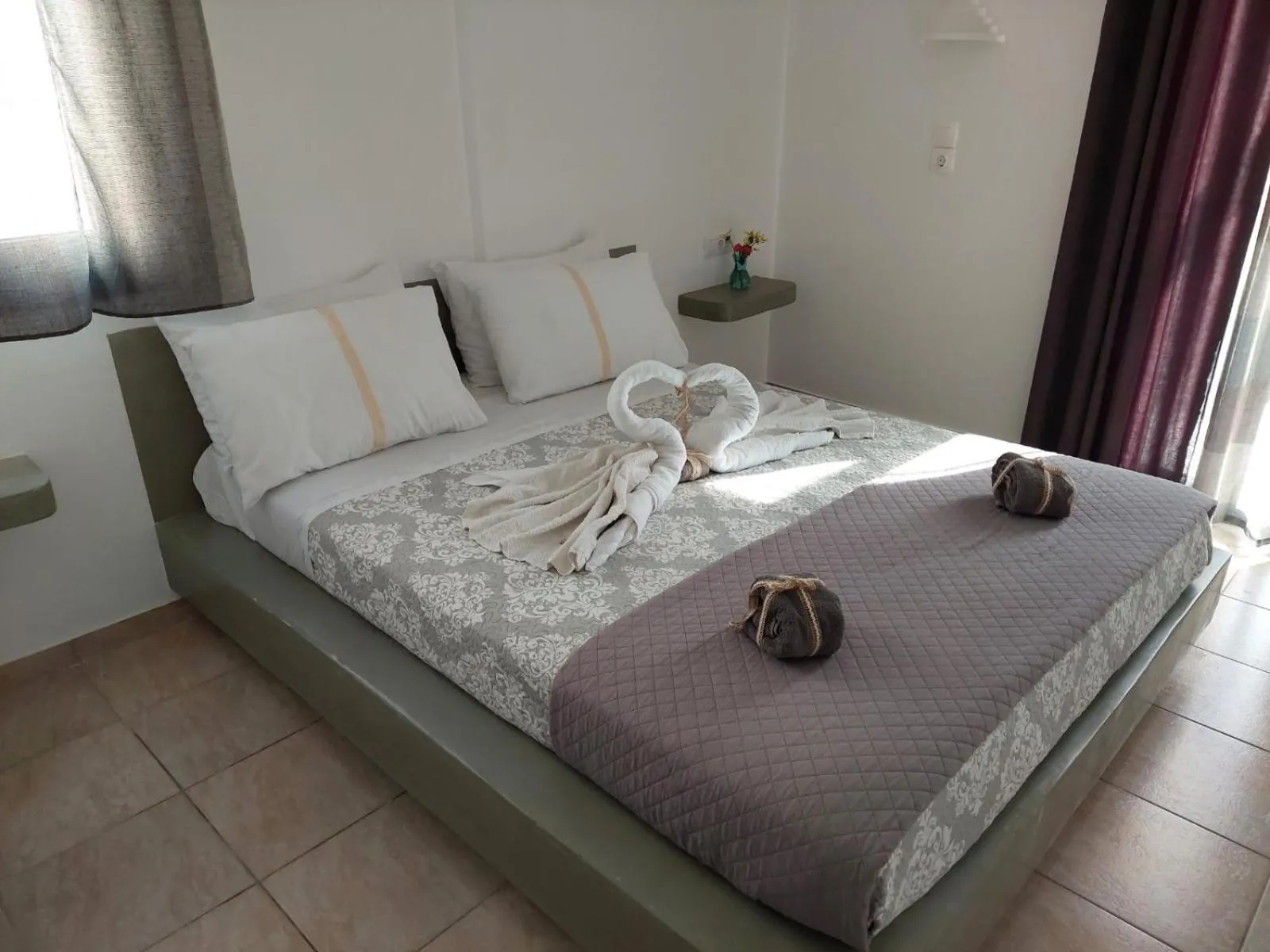 Bed in Marousi Rooms