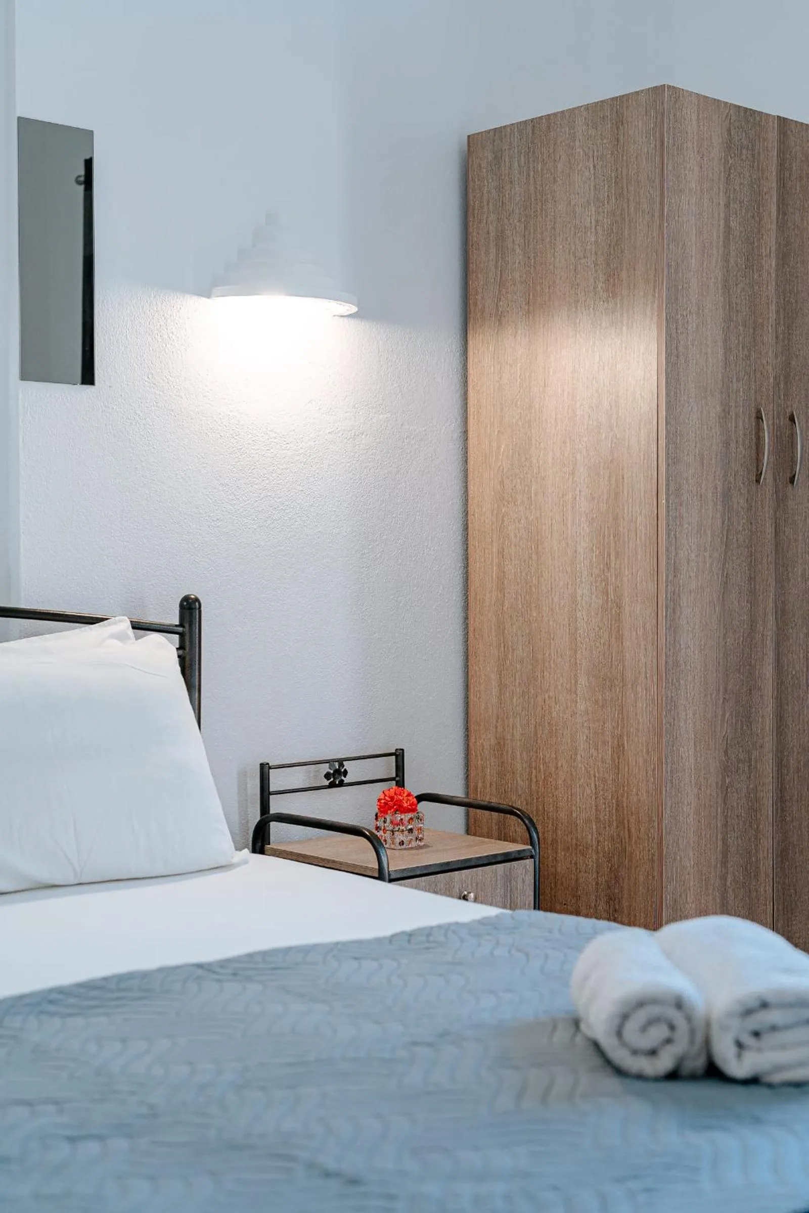 Bed in Marousi Rooms