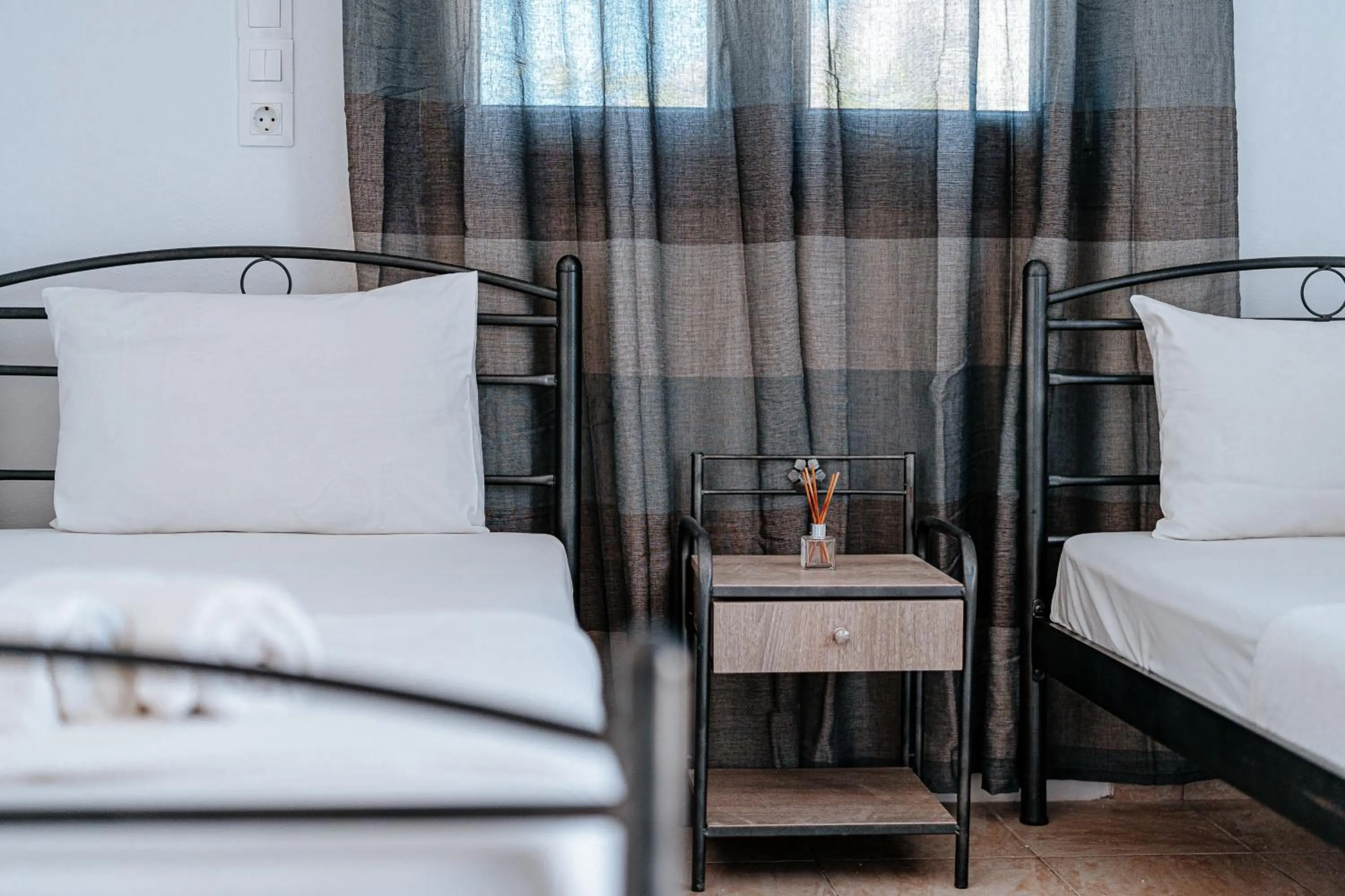Bed in Marousi Rooms
