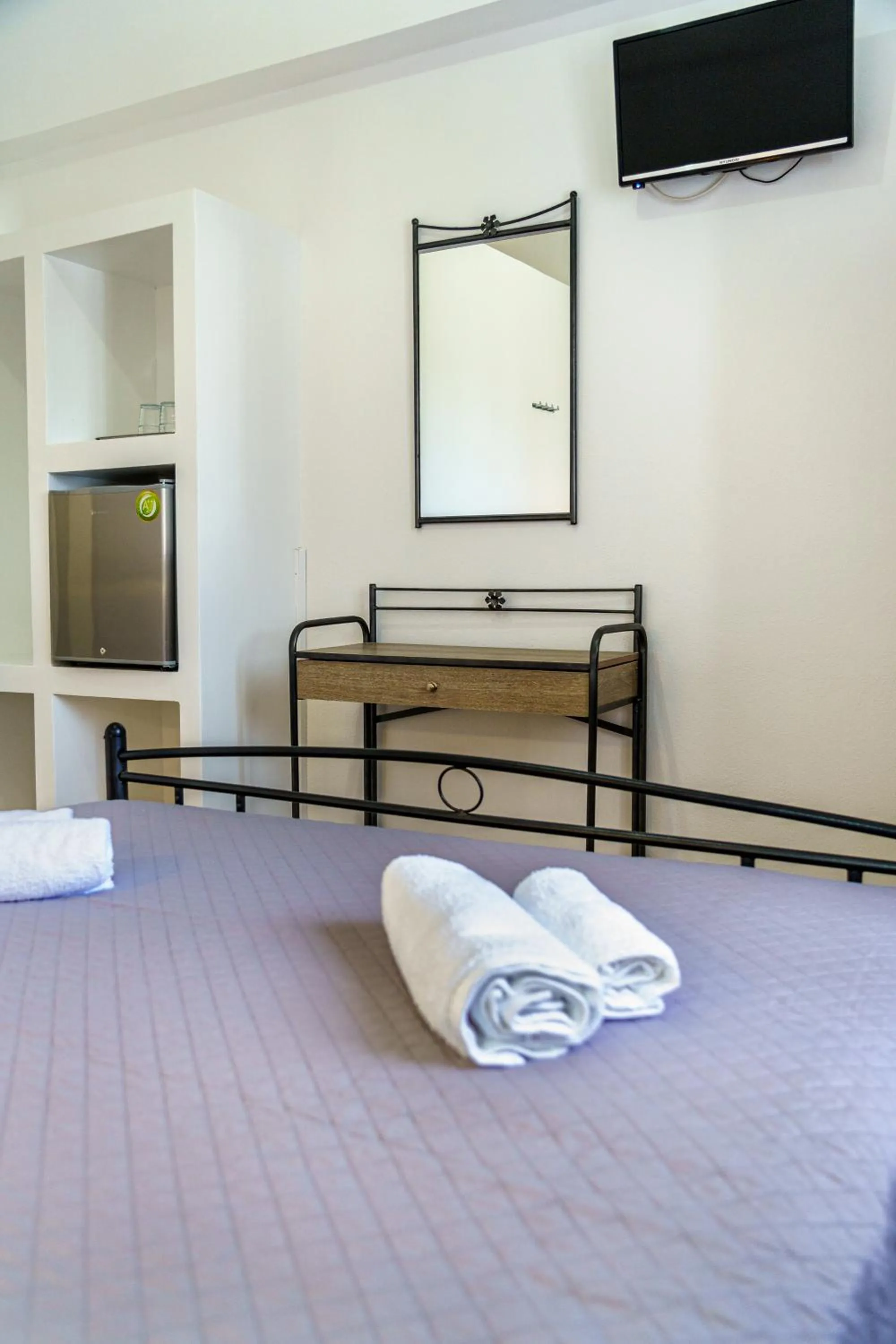 Bed in Marousi Rooms