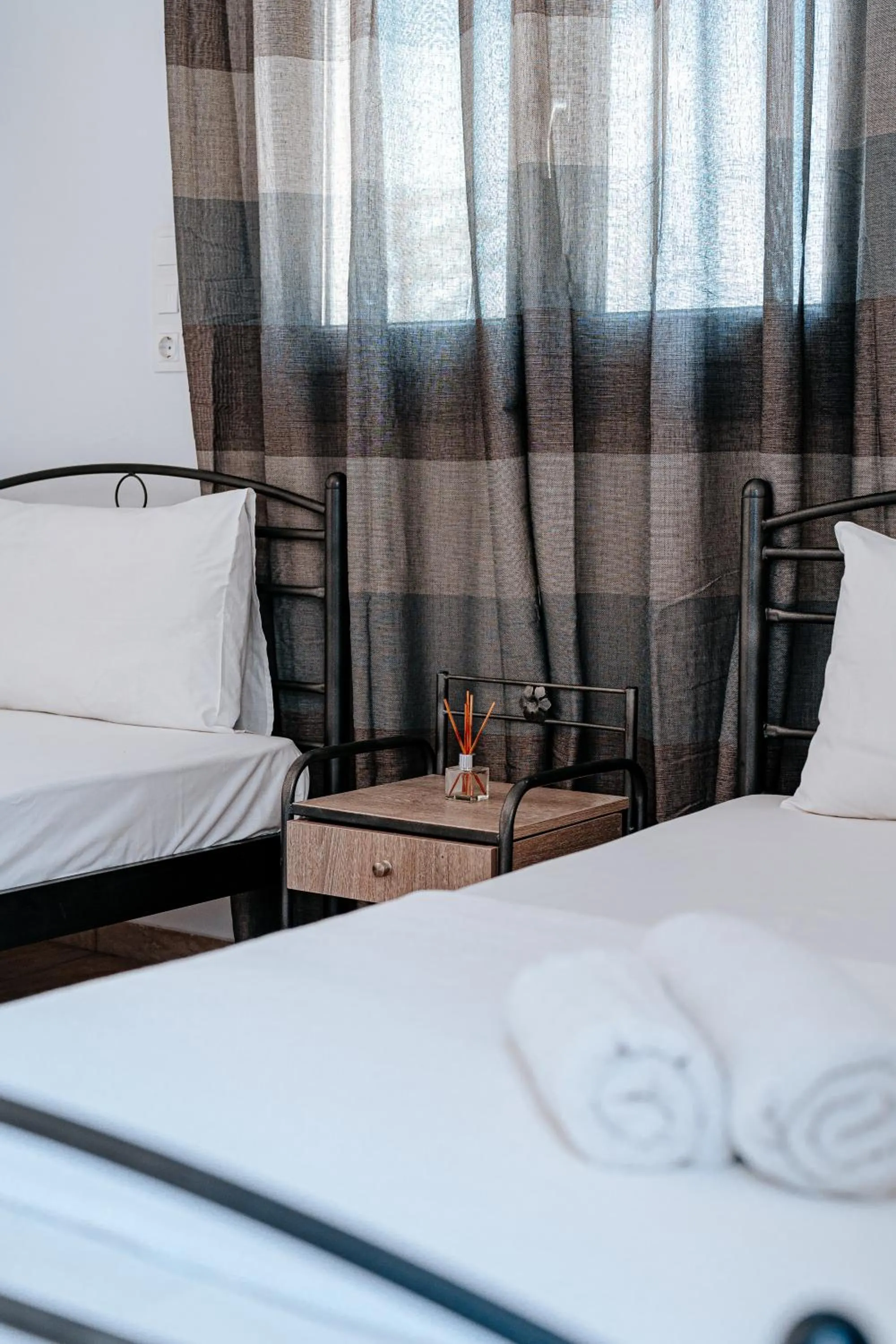 Bed in Marousi Rooms
