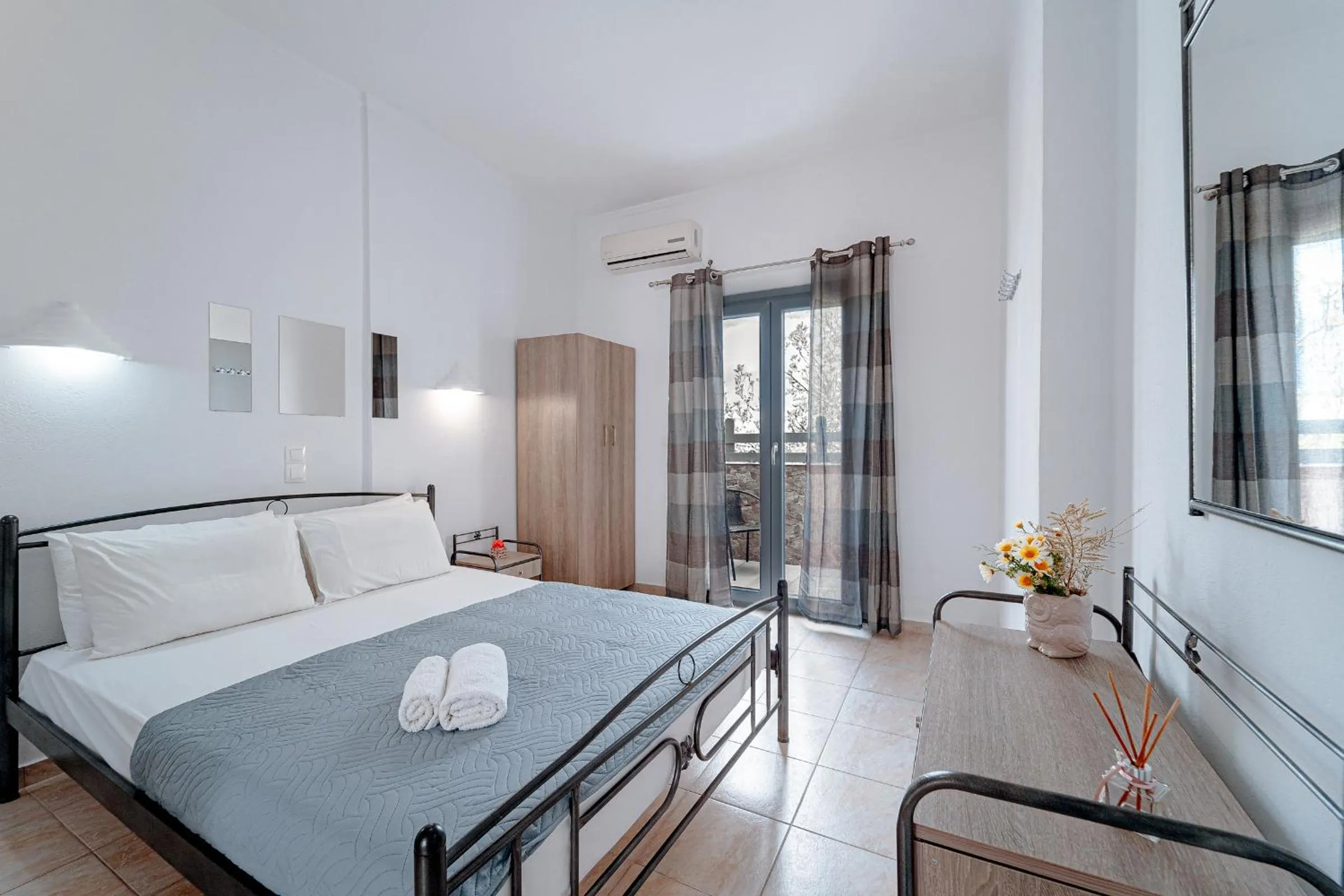 Bed in Marousi Rooms