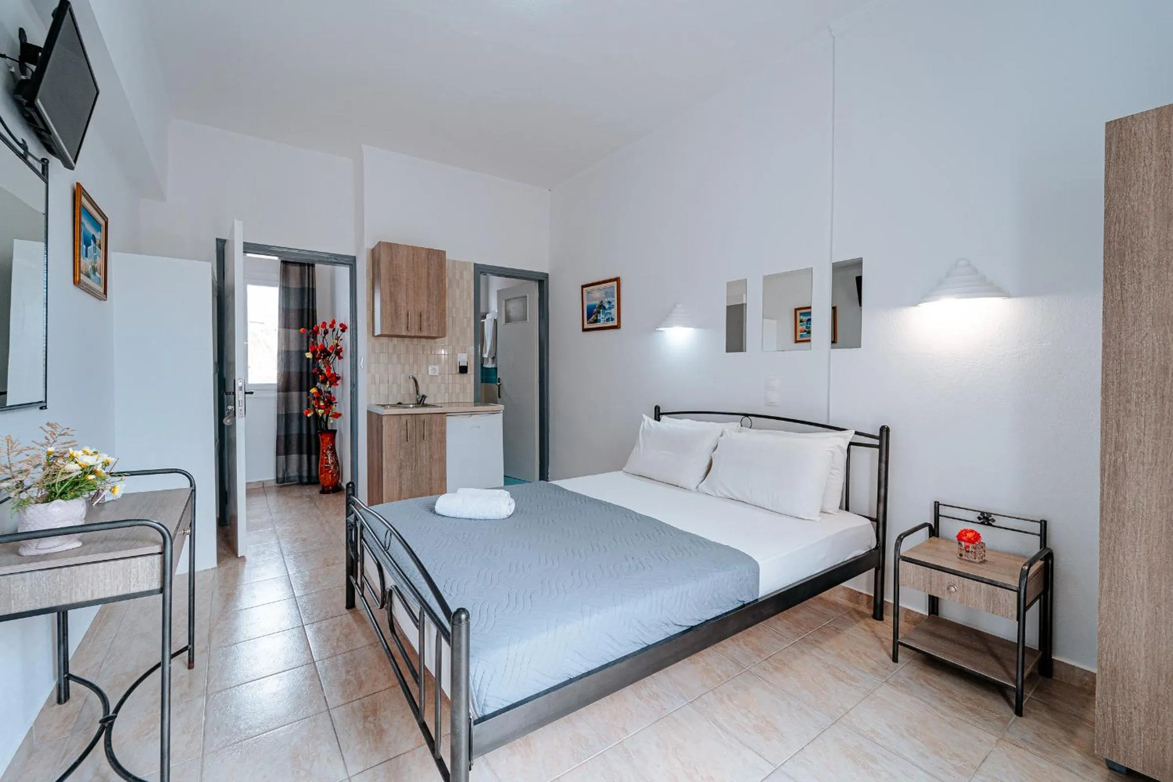 Bed in Marousi Rooms