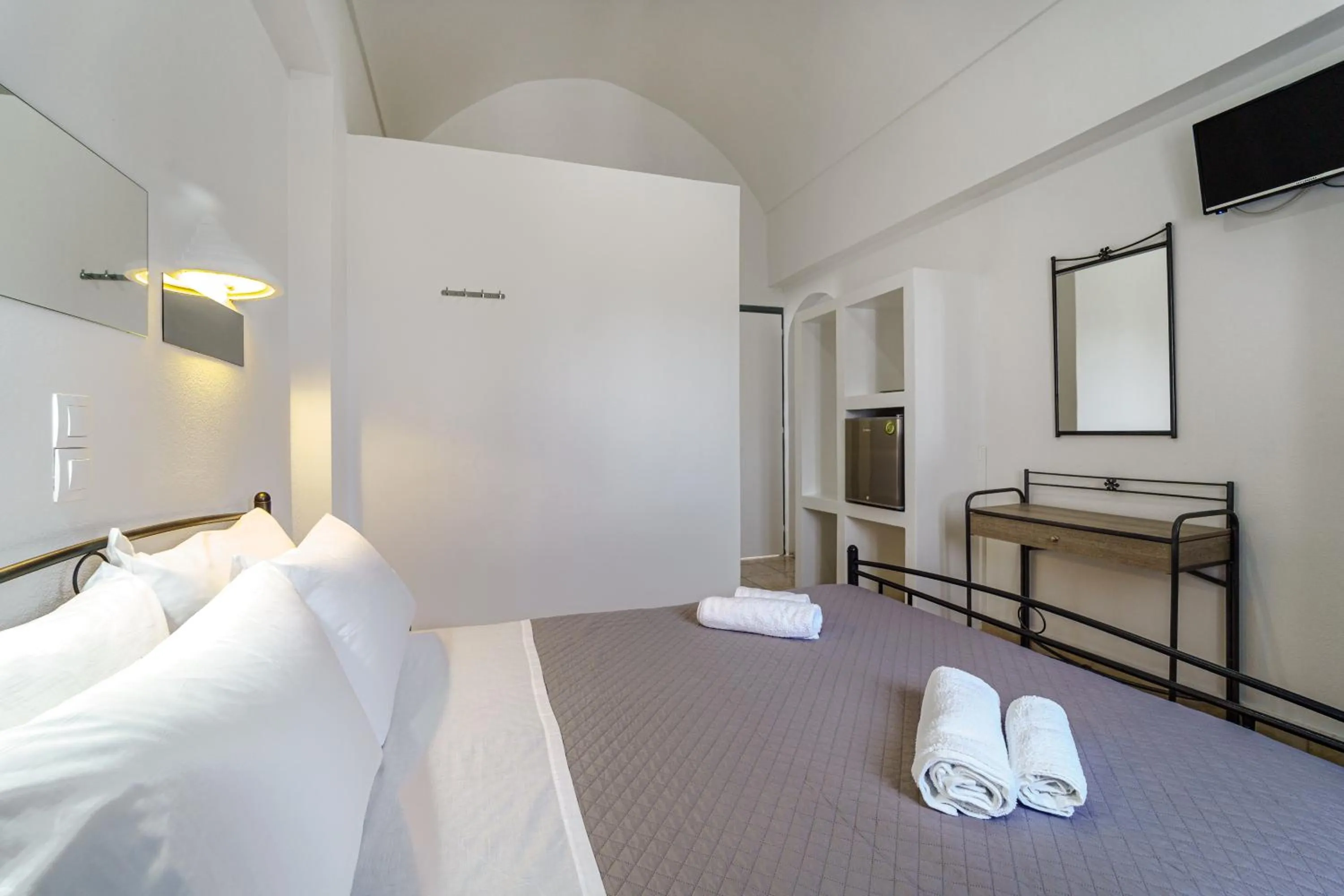 Bed in Marousi Rooms
