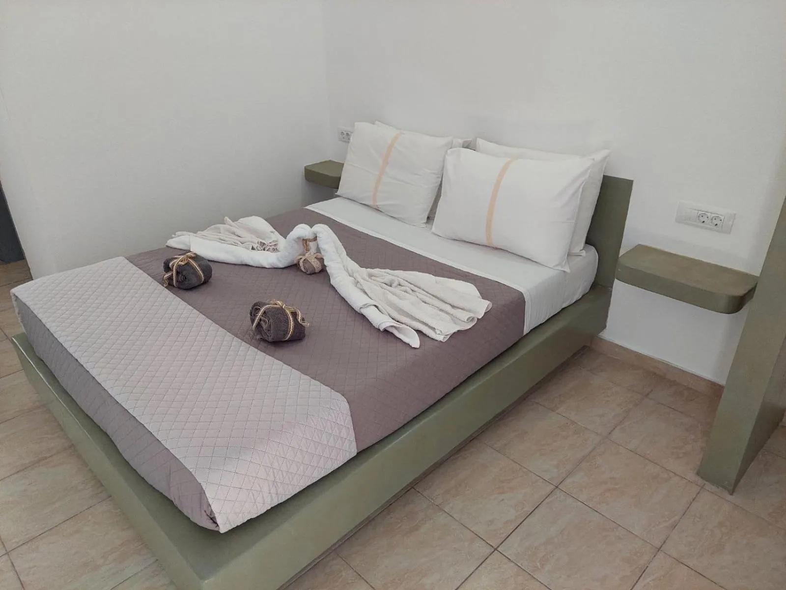 Bed in Marousi Rooms