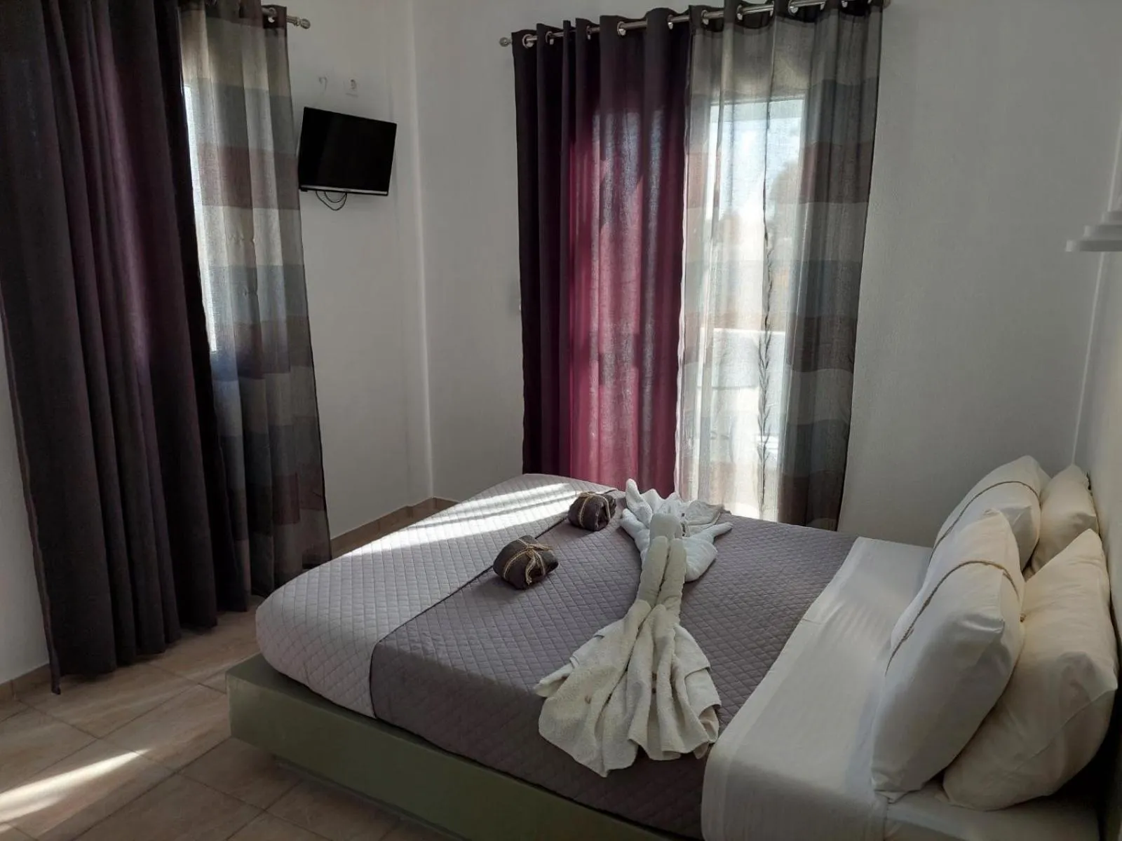 Bed in Marousi Rooms