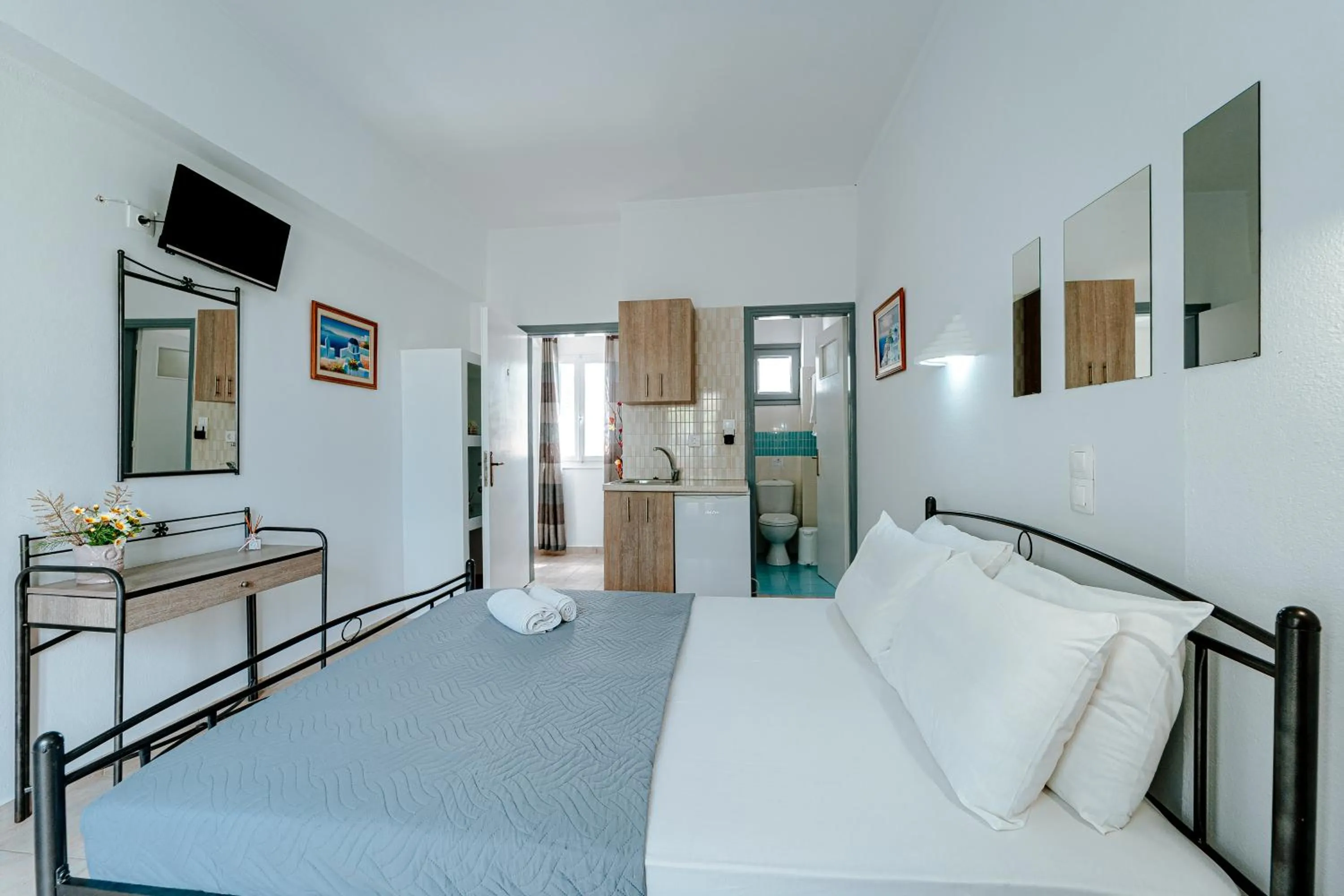 Bed in Marousi Rooms