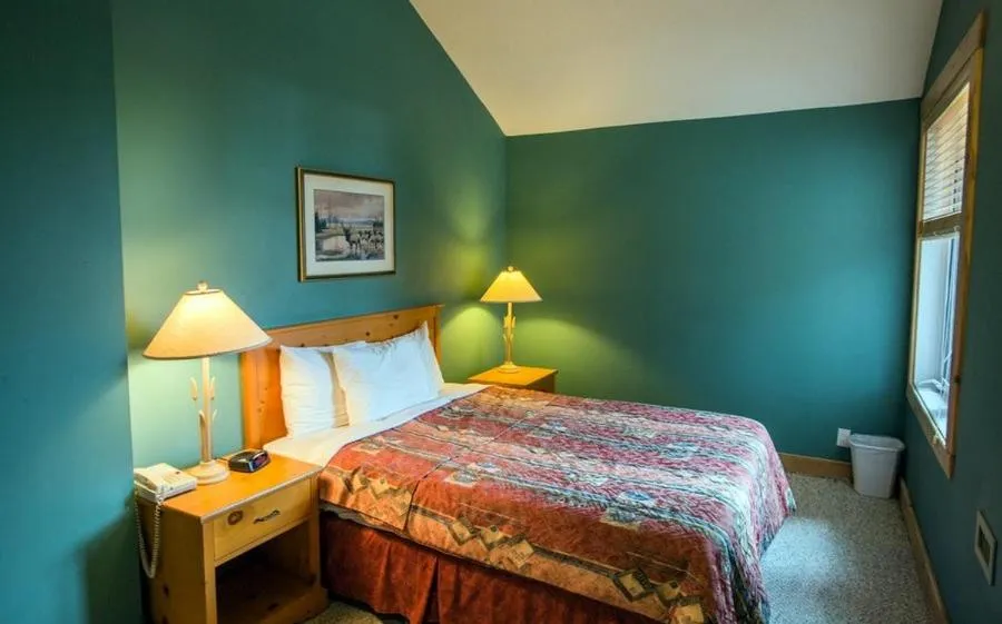 Bed in Cornerstone Lodge by Park Vacation Management