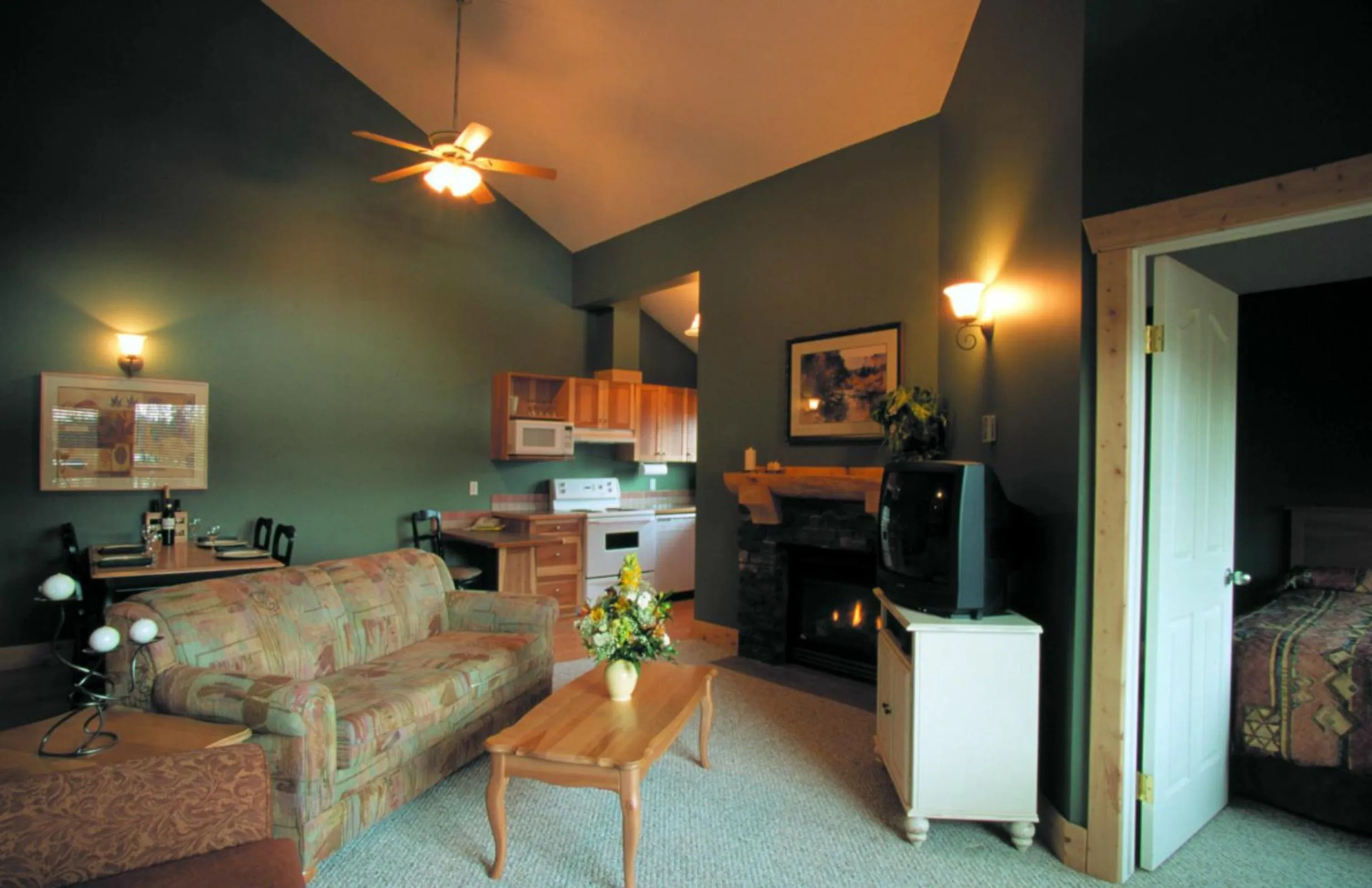 Communal lounge/ TV room in Cornerstone Lodge by Park Vacation Management