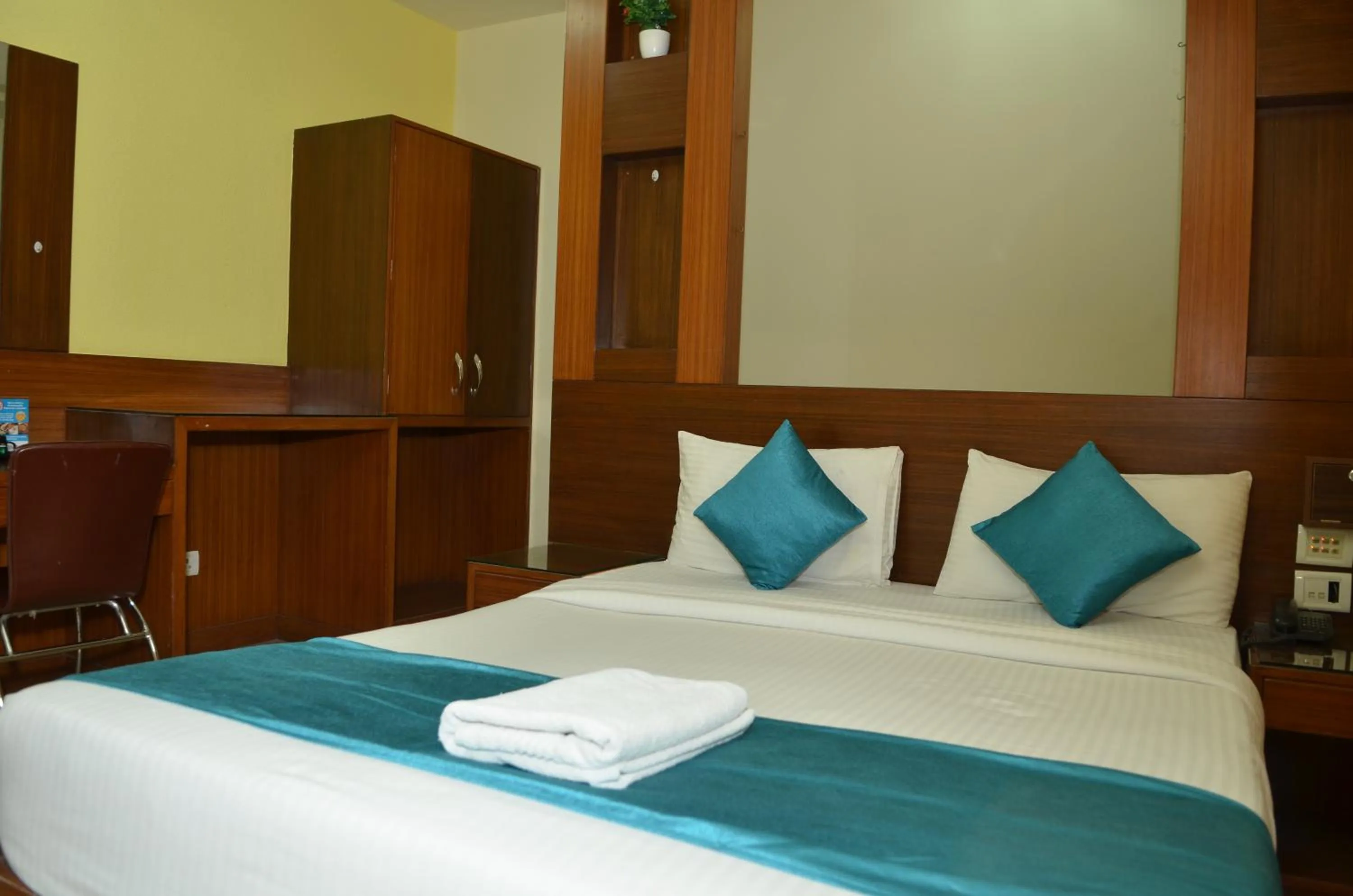 Bed in Cubbon Suites