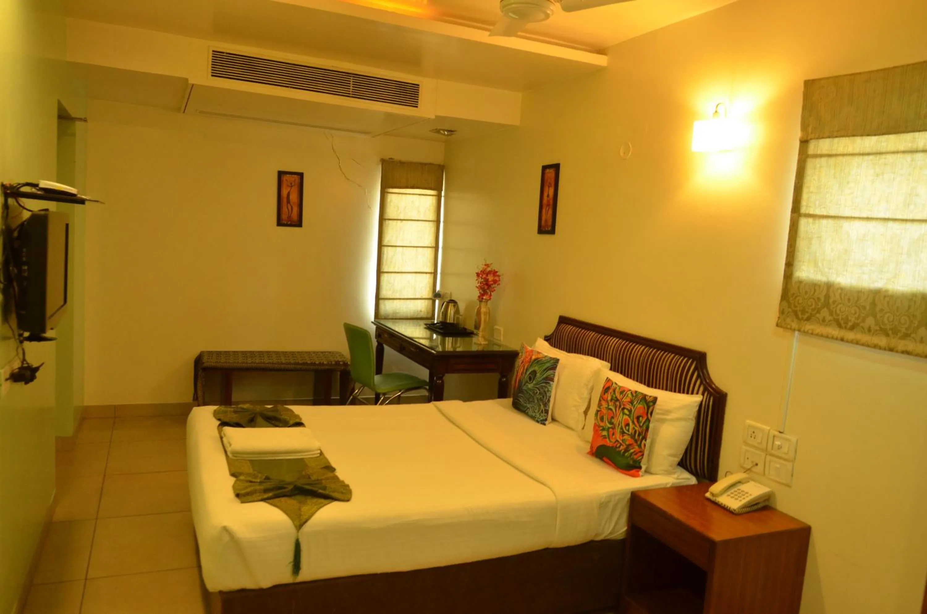 Bed in Cubbon Suites