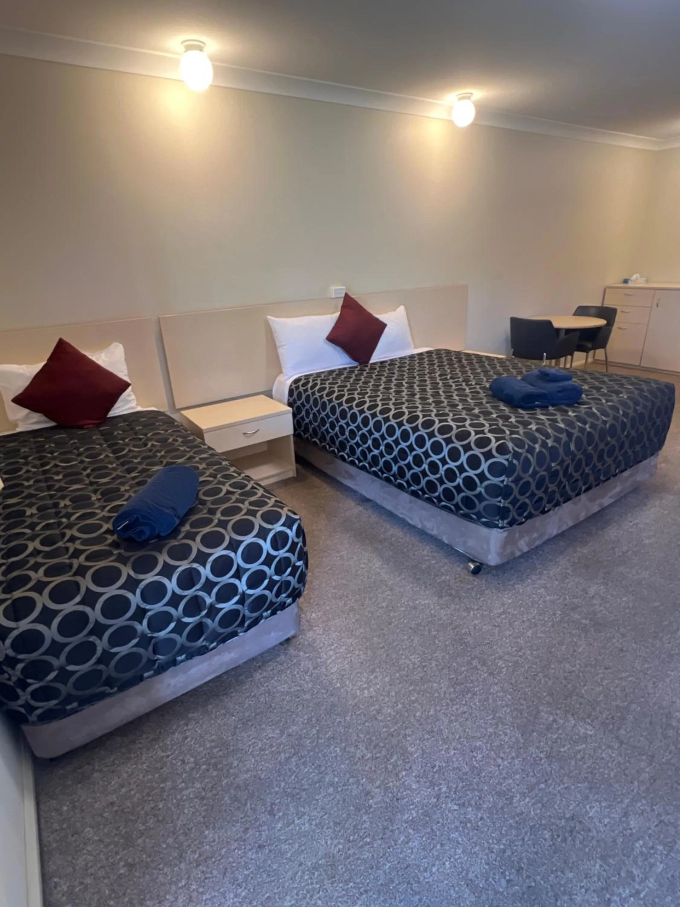 Bed in OVERLANDER MOTOR LODGE