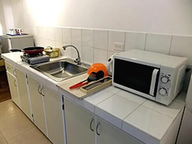 Kitchen or kitchenette in Himawari Hotel