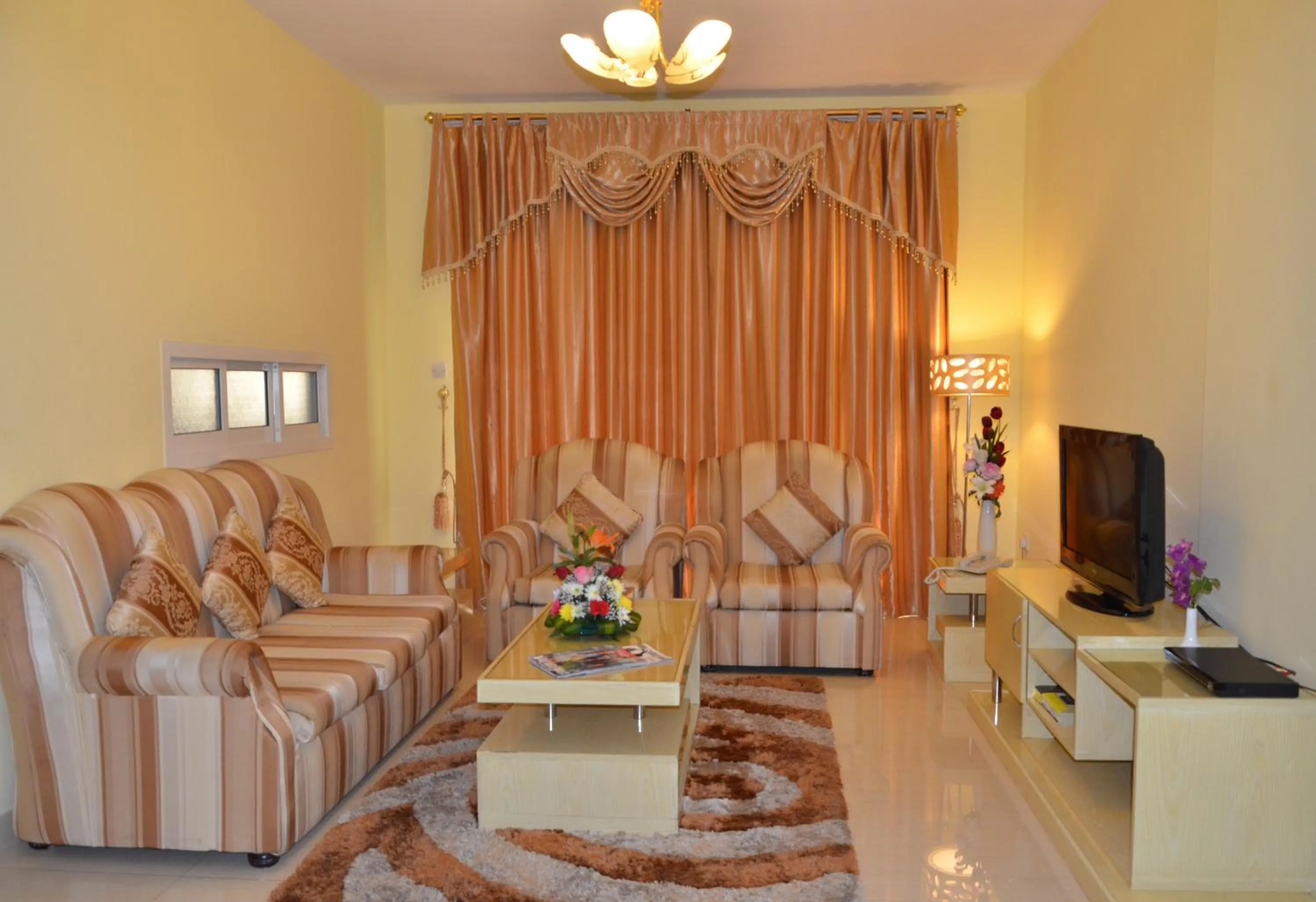 Living room in Al Jazeera Hotel Apartments LLC