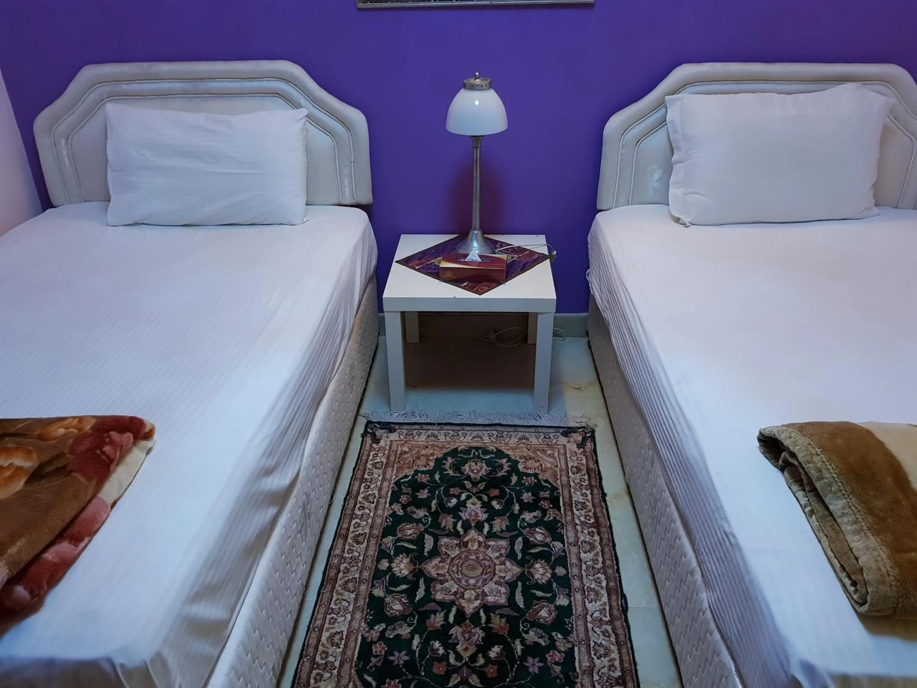 Bedroom in Al Jazeera Hotel Apartments LLC