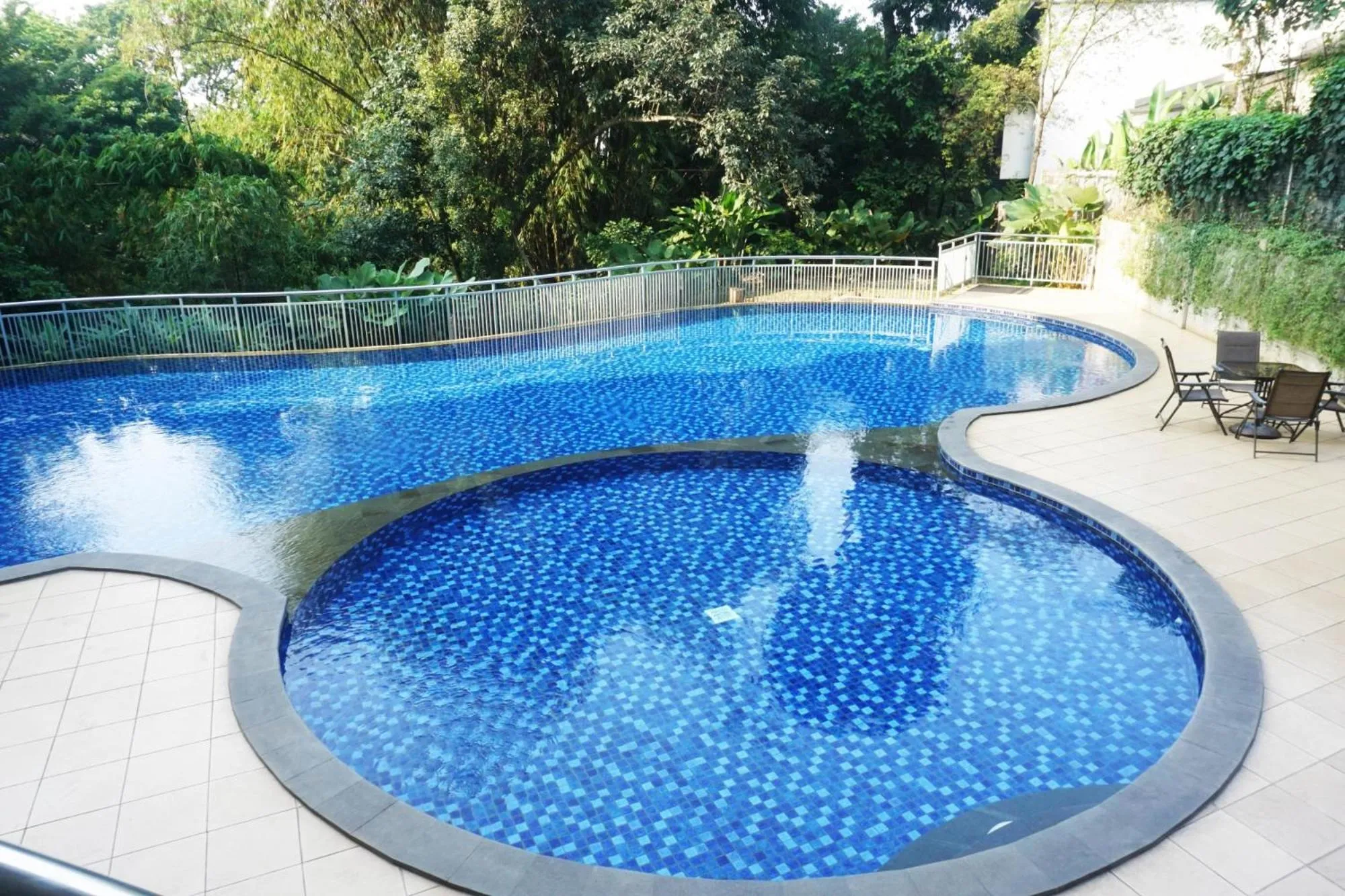 Swimming pool in Stylish 1BR near ITB University at Dago Suites Apartment By Travelio