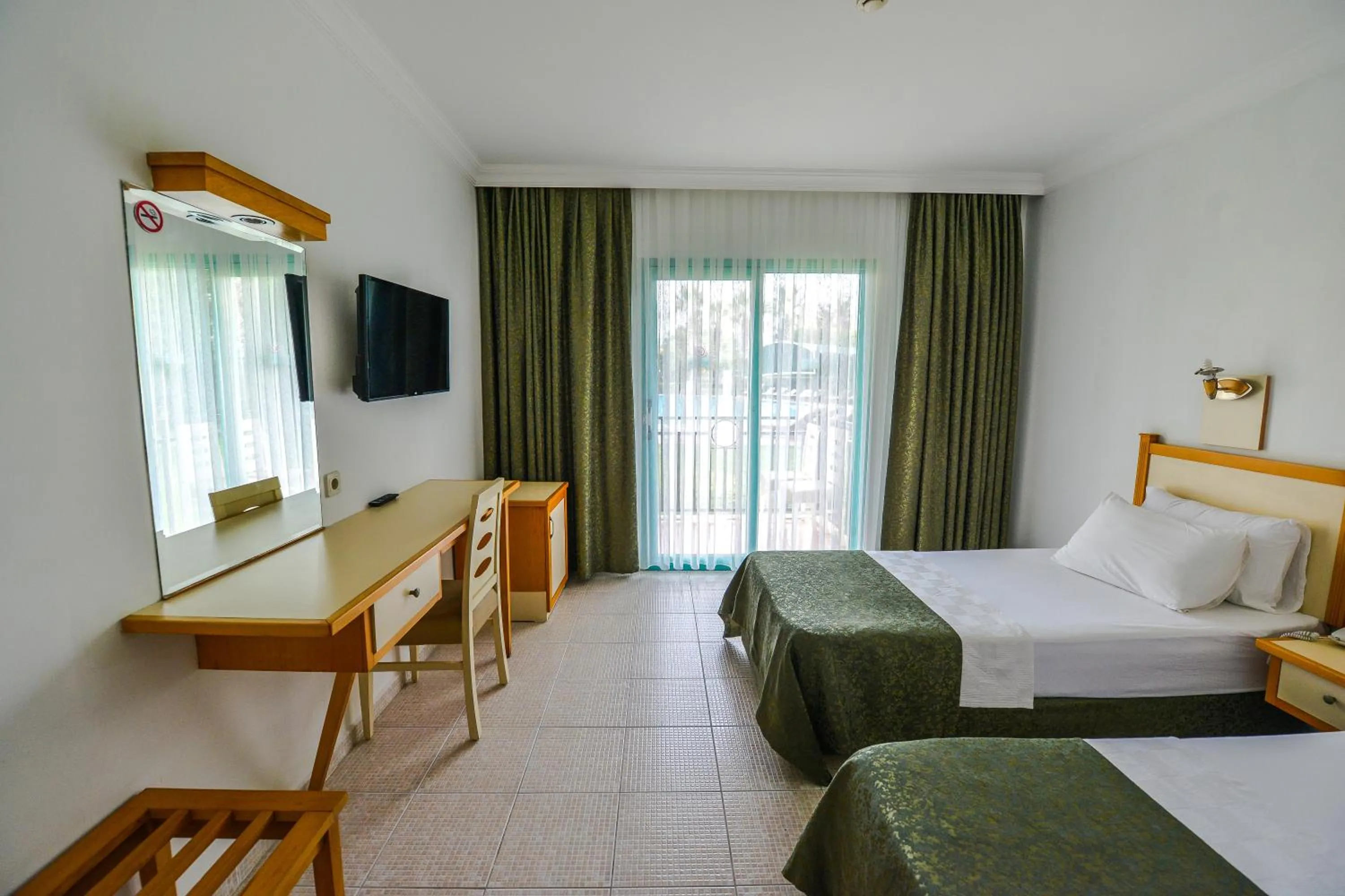 Bed in Rebin Beach Hotel