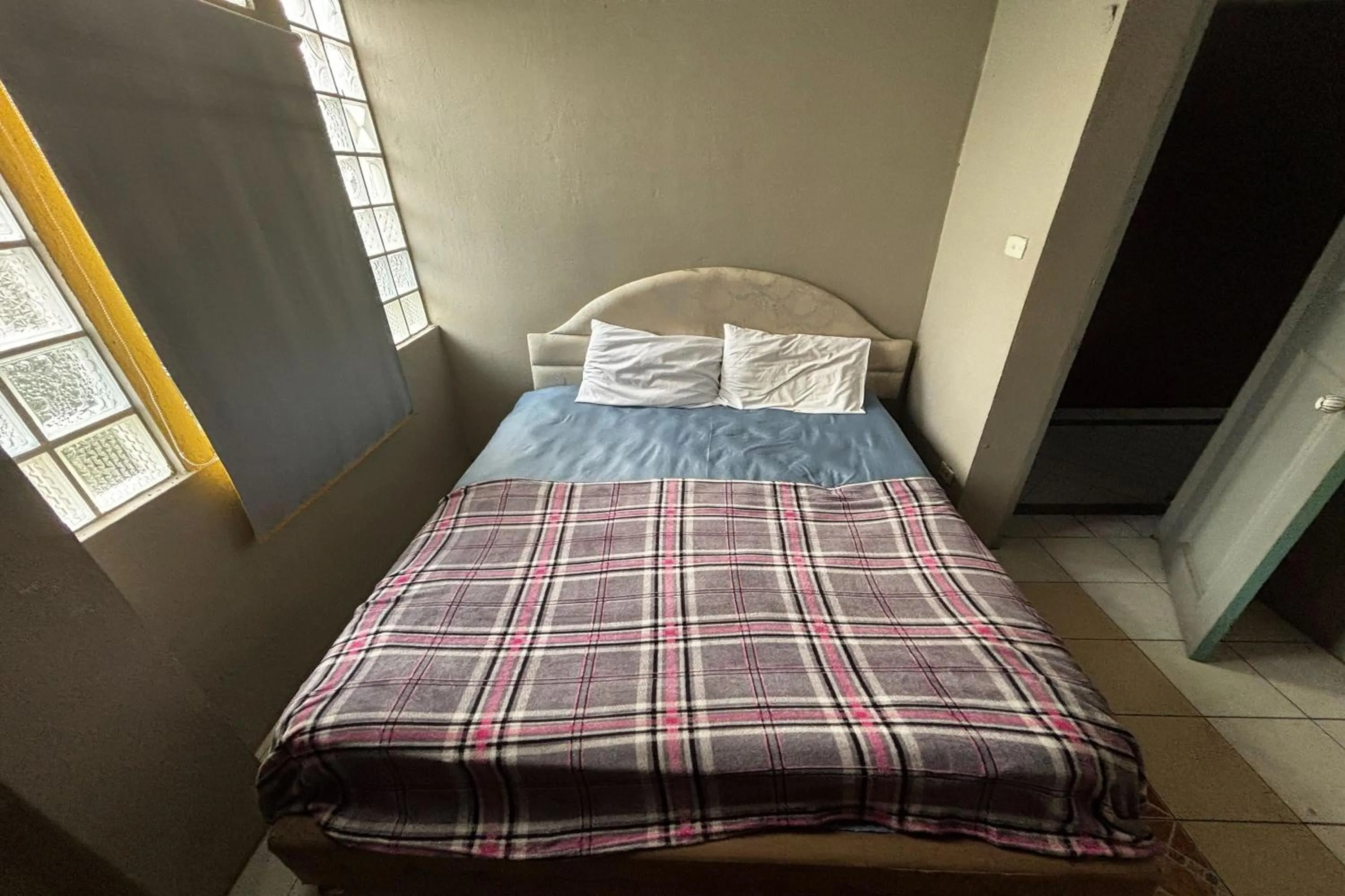 Bed in OYO 457 Panasan Villa