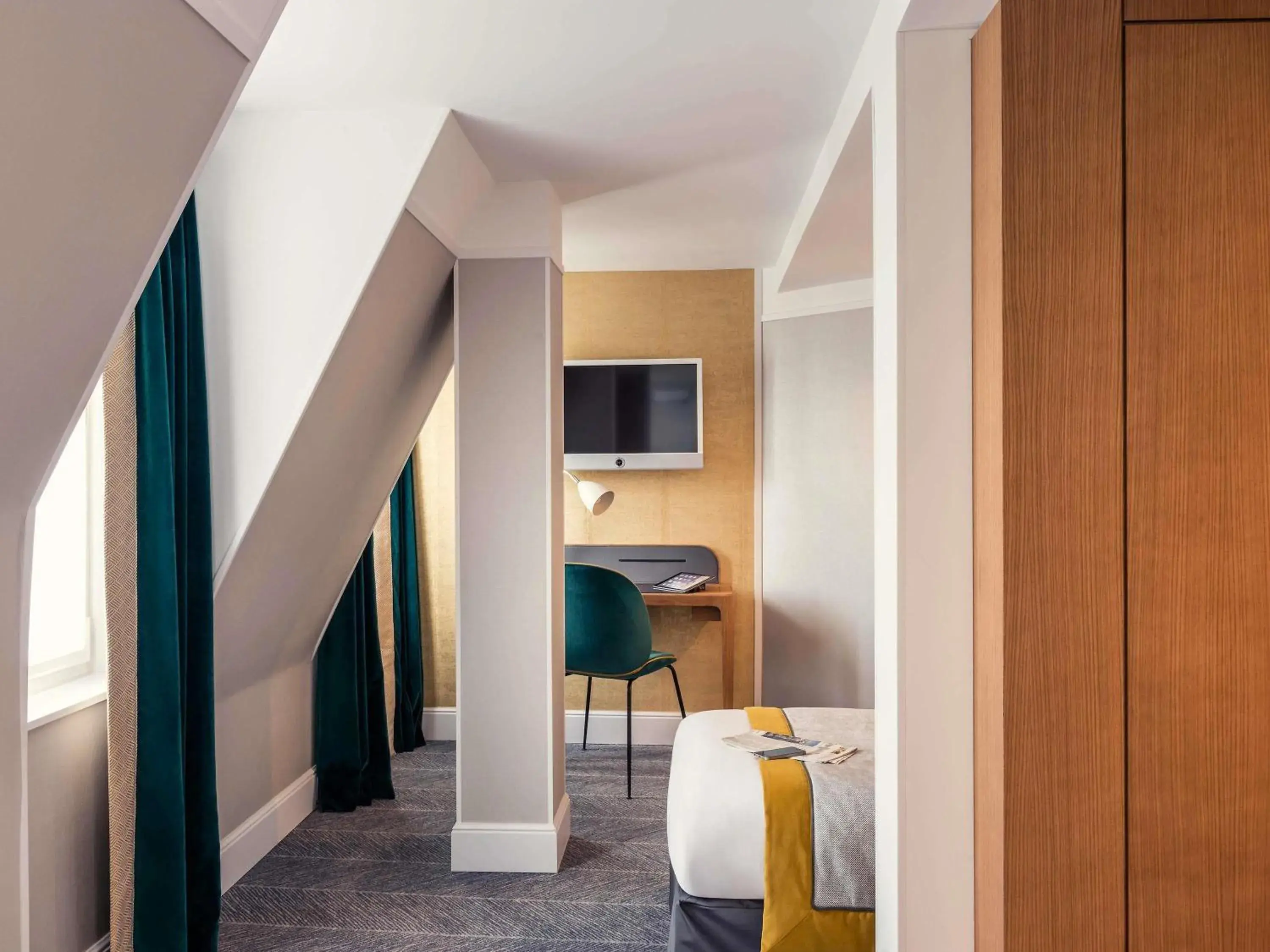 Bedroom in Mercure Paris Opera Garnier Hôtel & Spa Bedroom in Mercure Paris Opera Garnier Hôtel & Spa