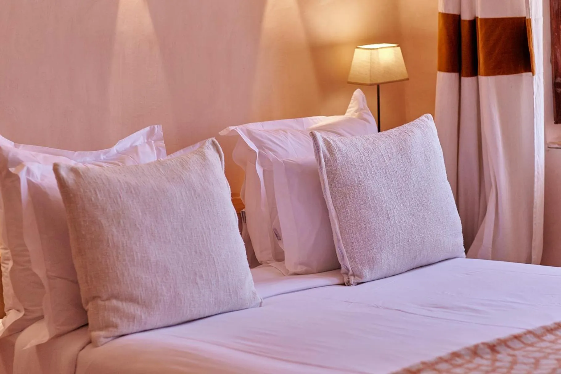 Bed in Riad Caravane