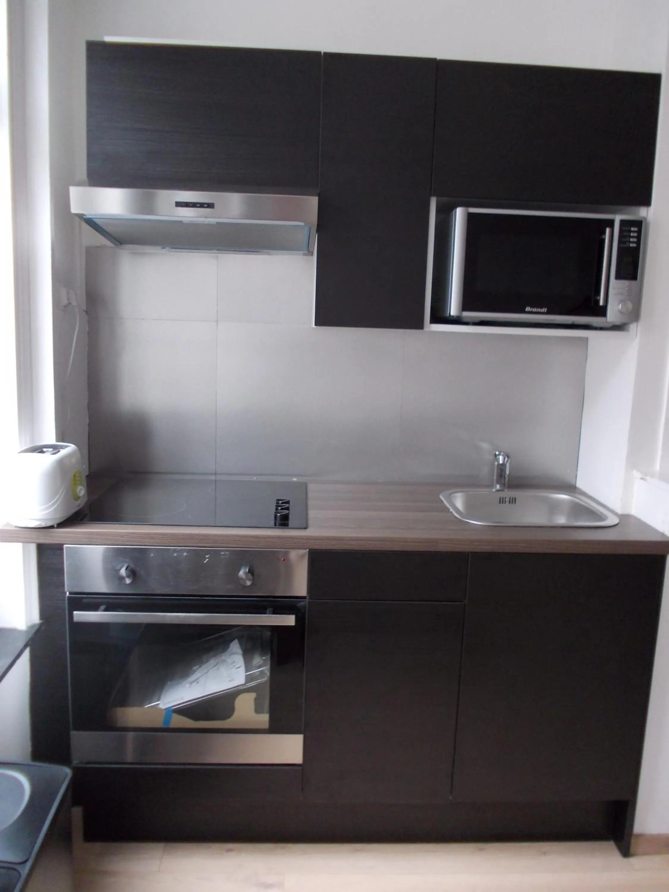 Kitchen or kitchenette in Nationale Appart Hotel