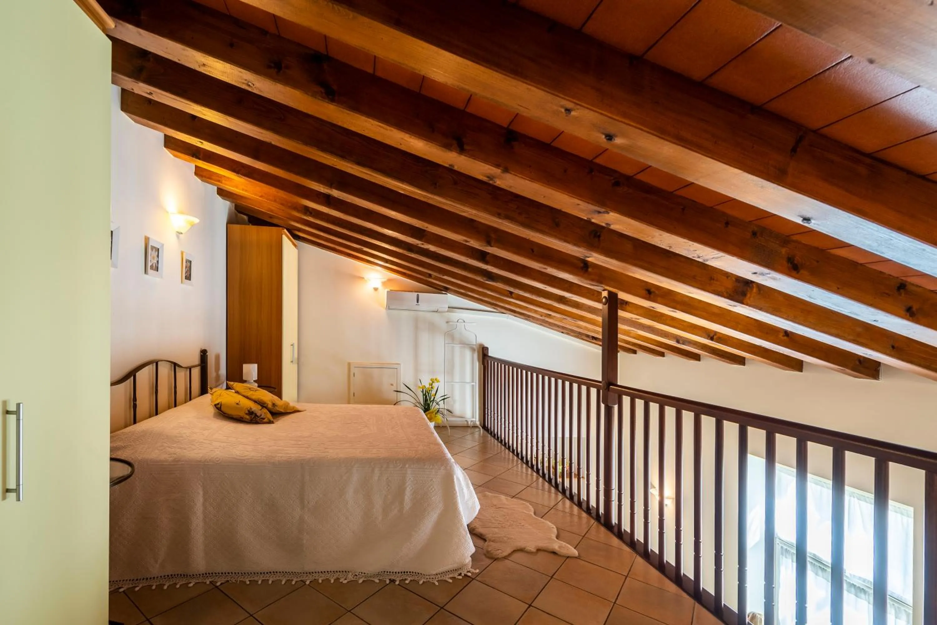 Bed in Flowers Apartments