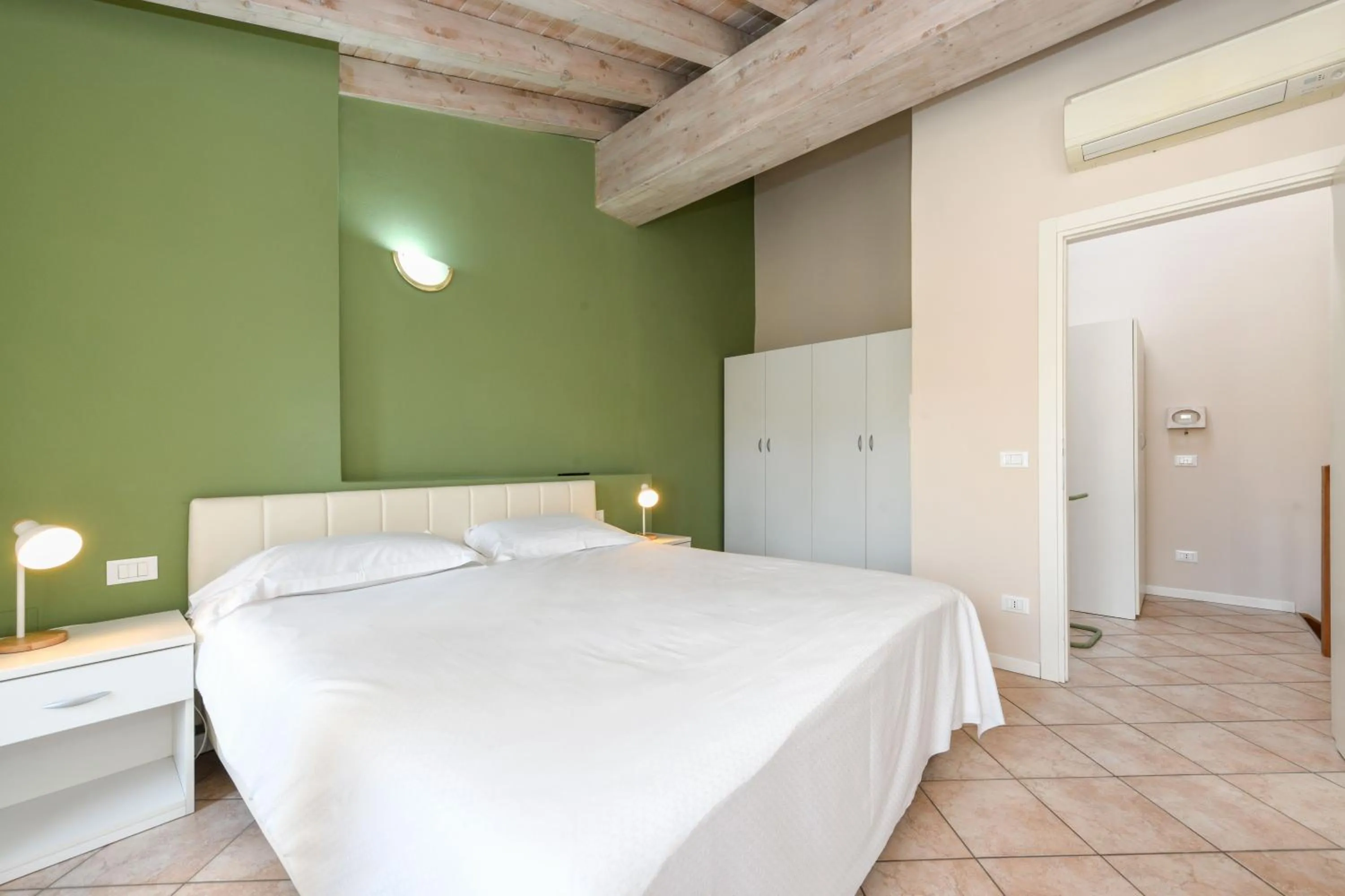 wardrobe, Bed in Flowers Apartments