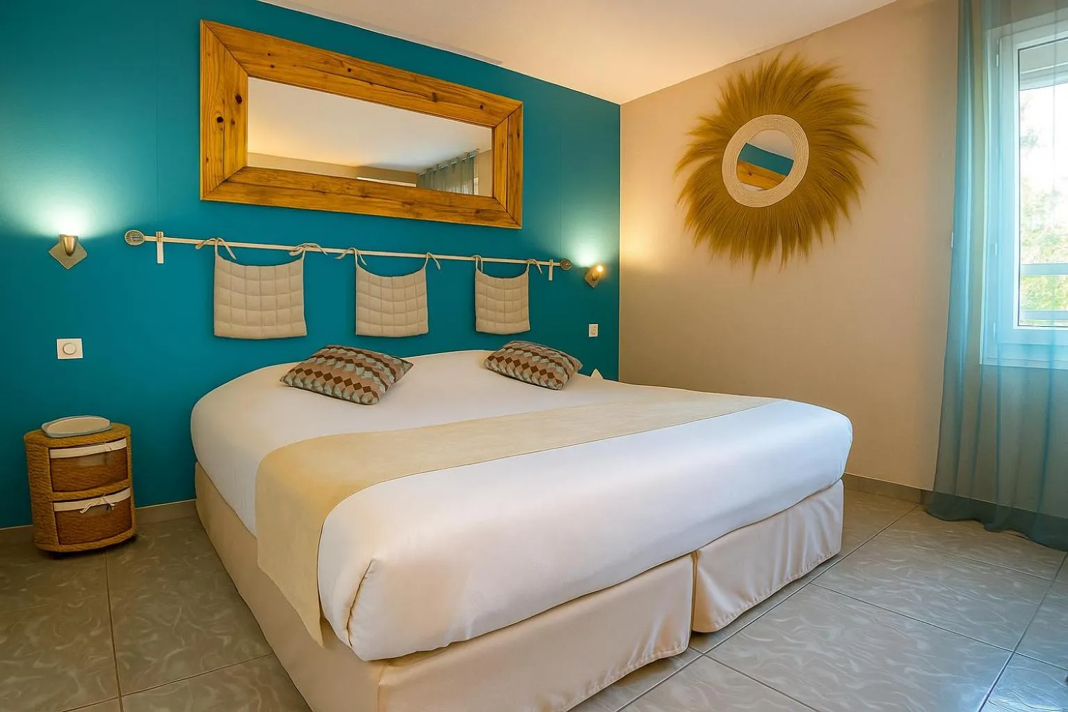 Bed in Logis Hôtel Les Grenadines