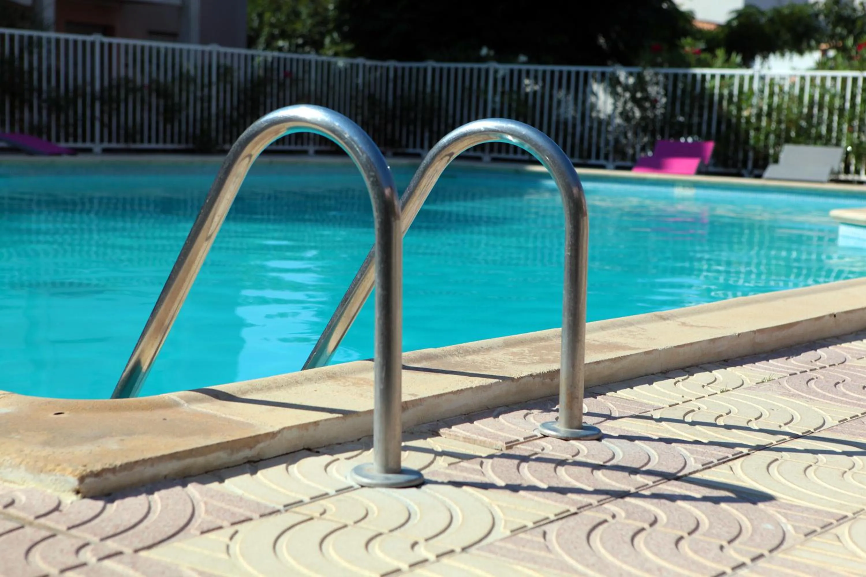 Swimming pool in Logis Hôtel Les Grenadines