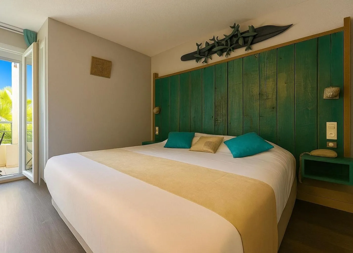 Bed in Logis Hôtel Les Grenadines