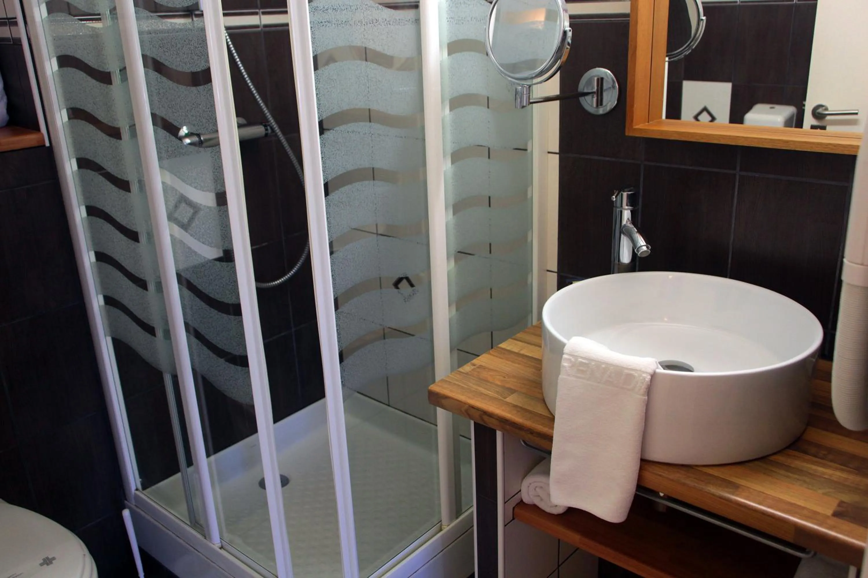 Bathroom in Logis Hôtel Les Grenadines