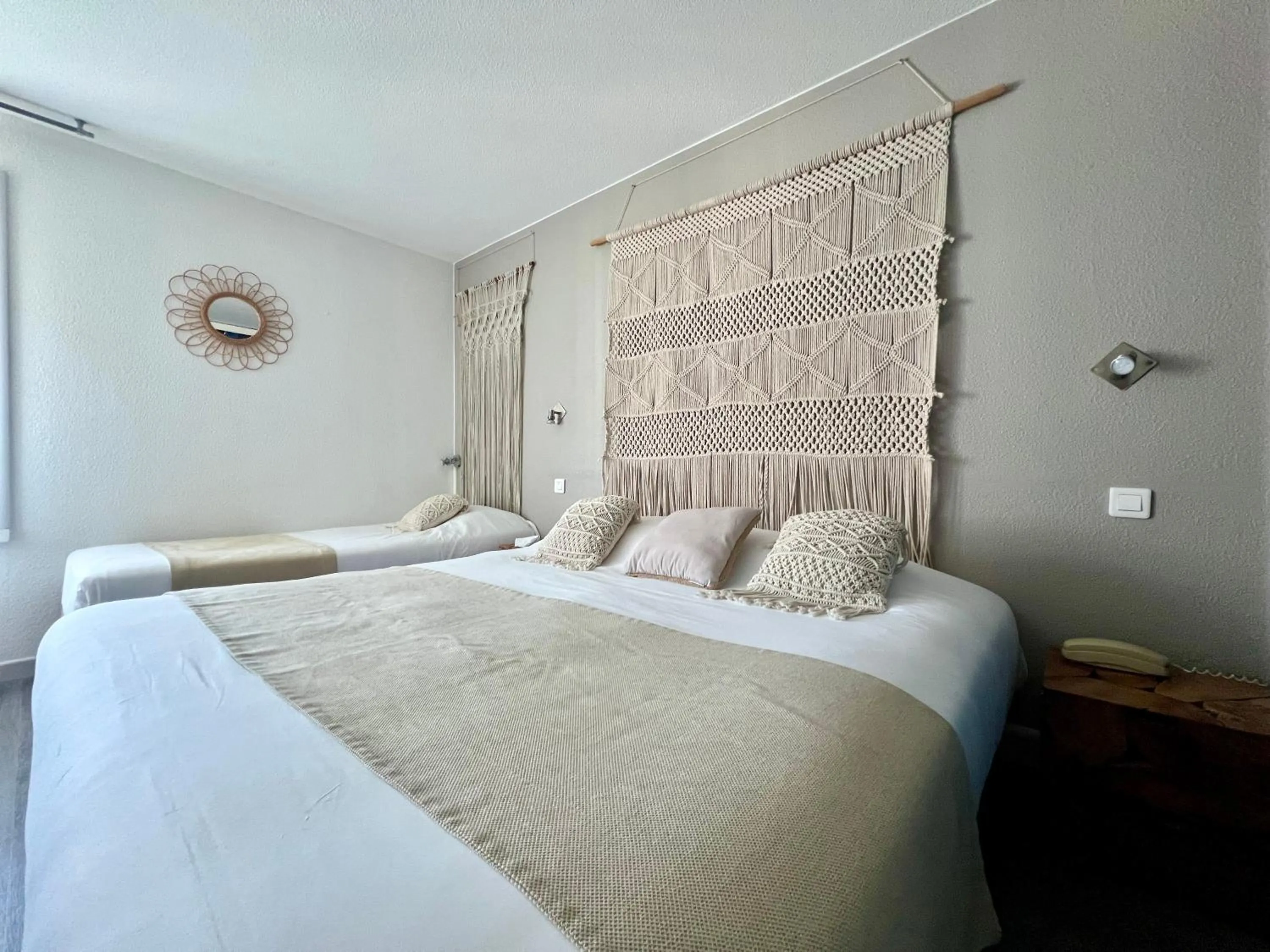 Bed in Logis Hôtel Les Grenadines