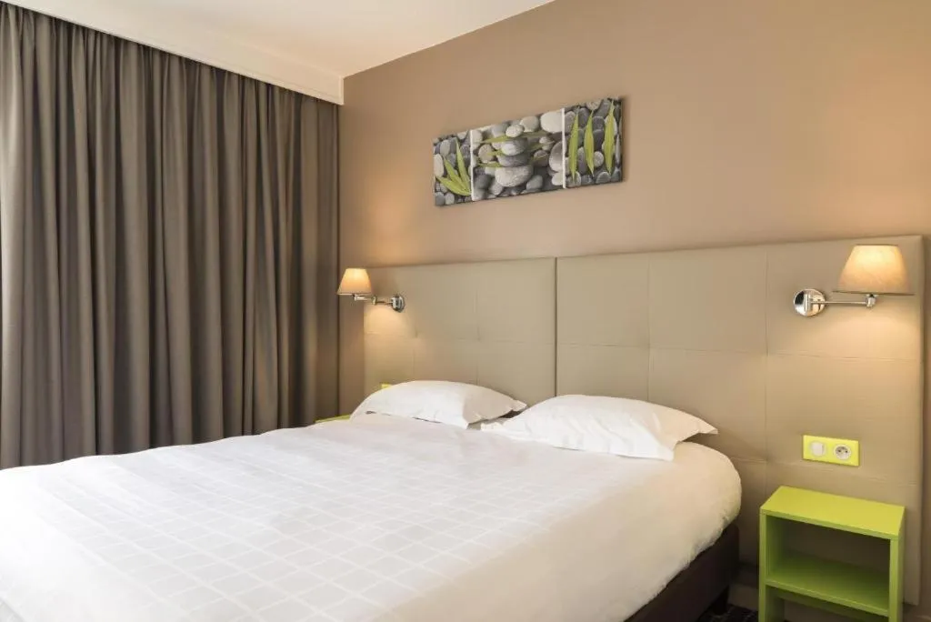 Bed in BRIT HOTEL Confort Le Limouzi TULLE