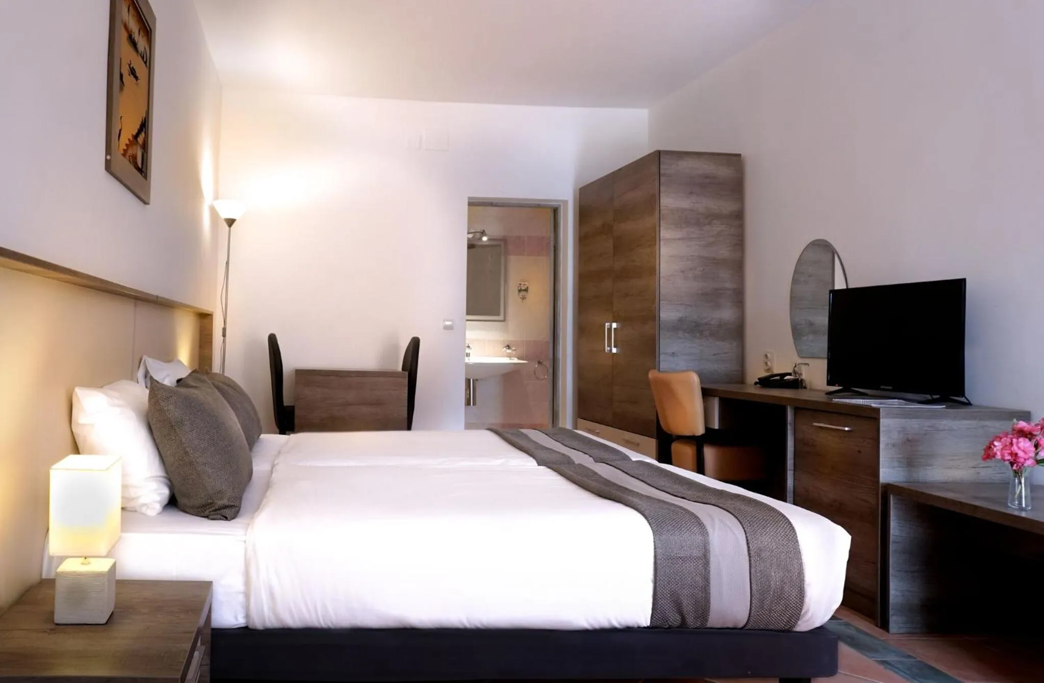 Bed in Sunbeach Hotel & Resort