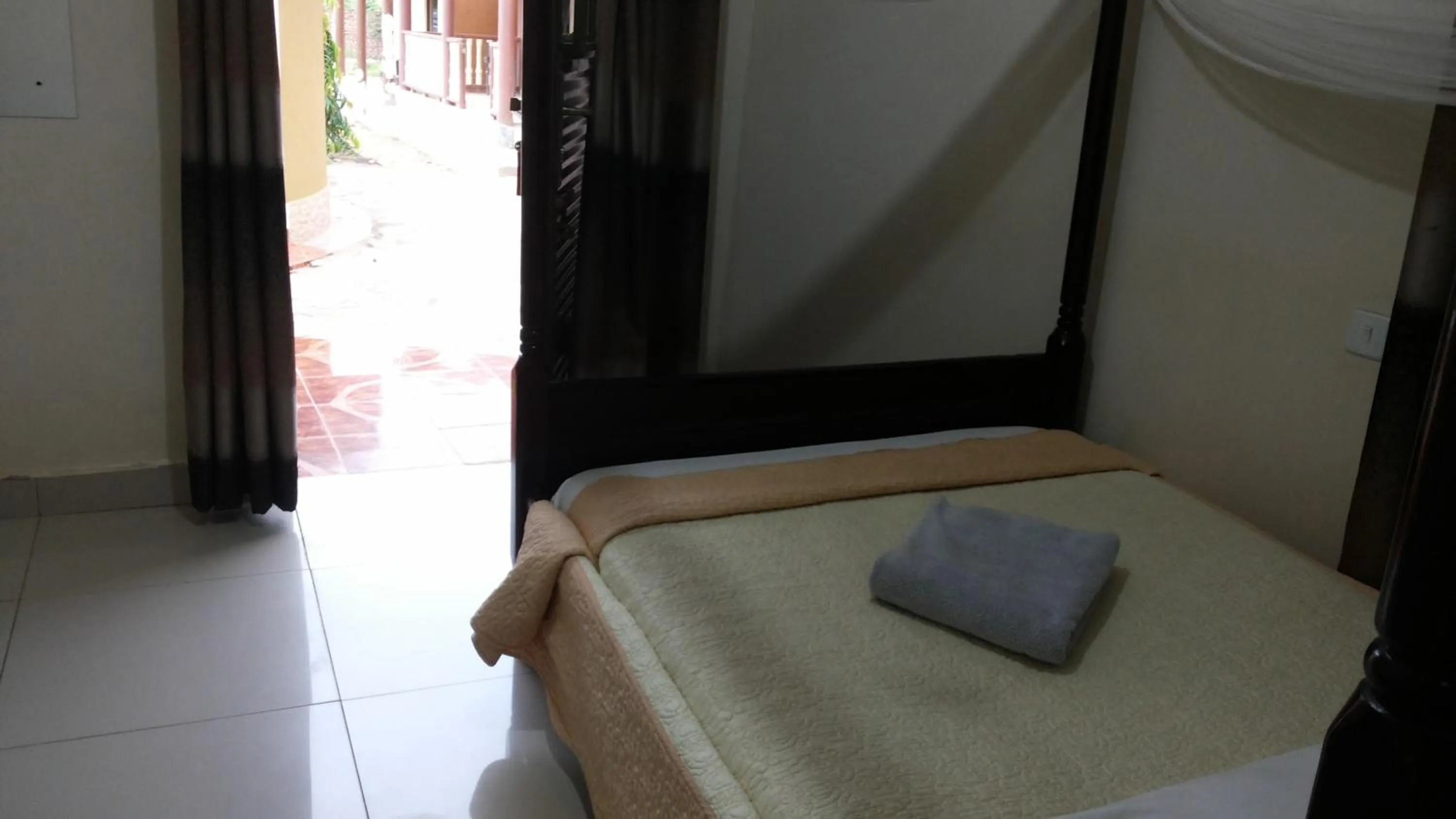 Bed in Kalalo Cottage Inn