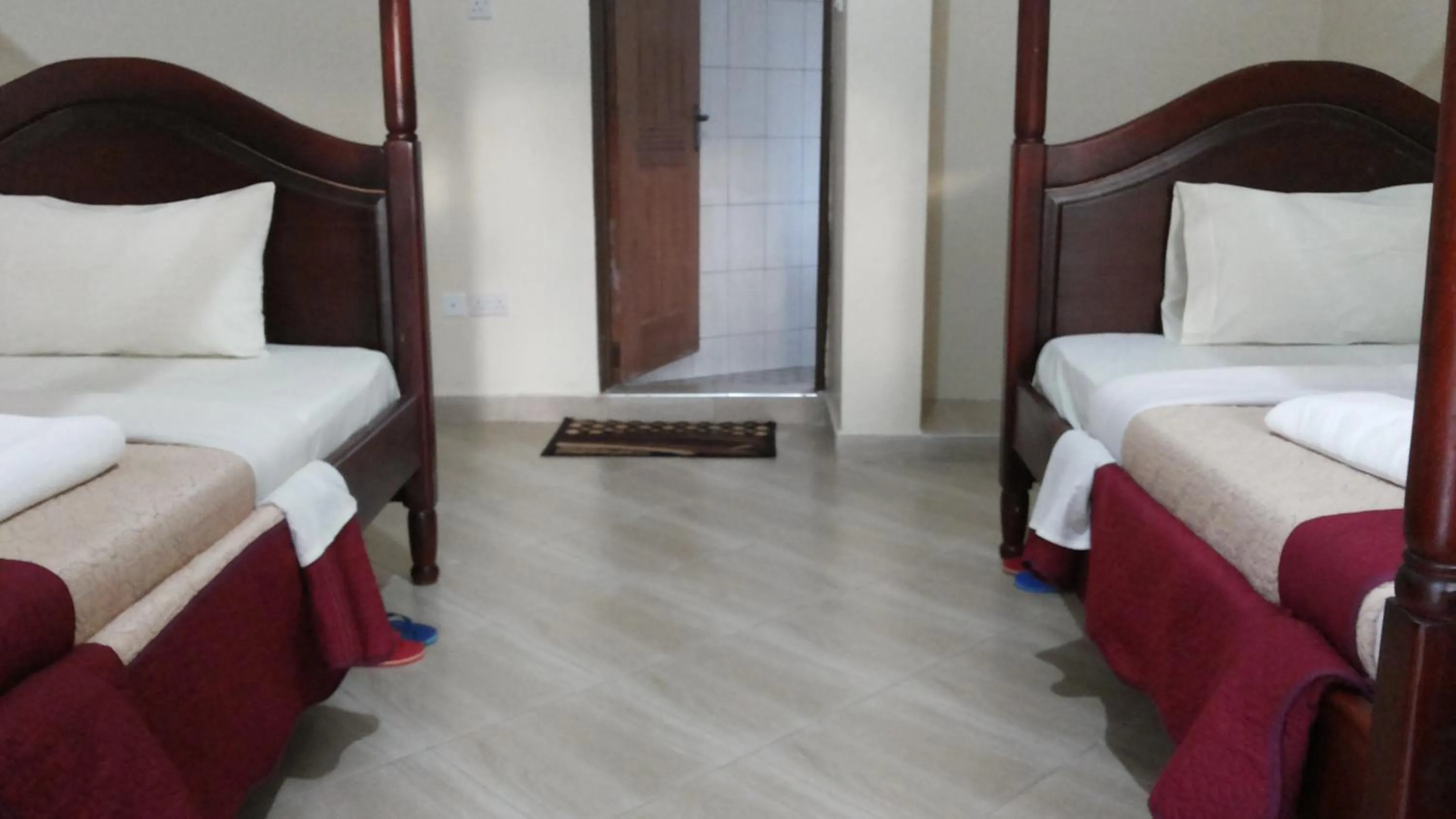 Bed in Kalalo Cottage Inn