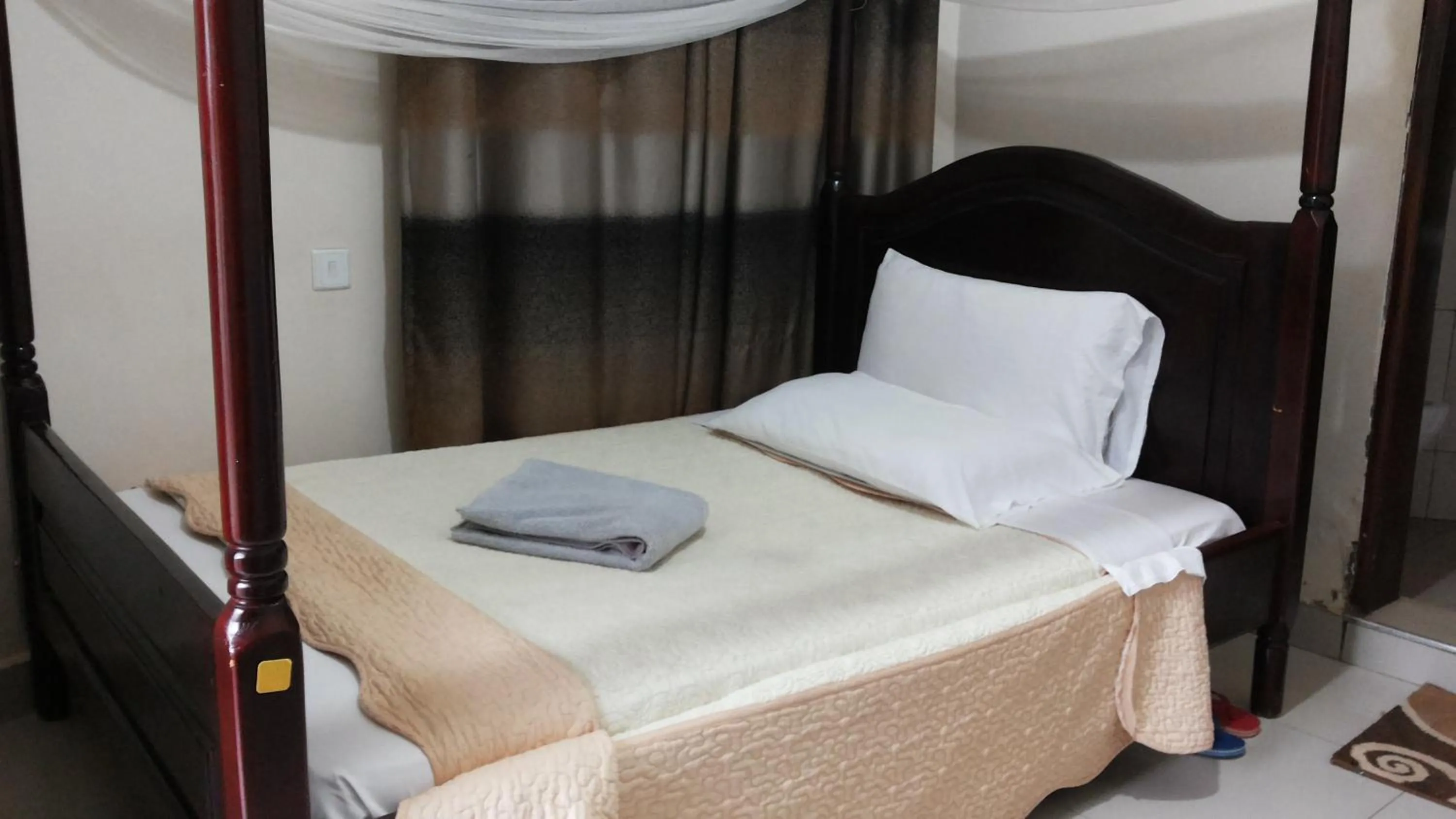 Bed in Kalalo Cottage Inn